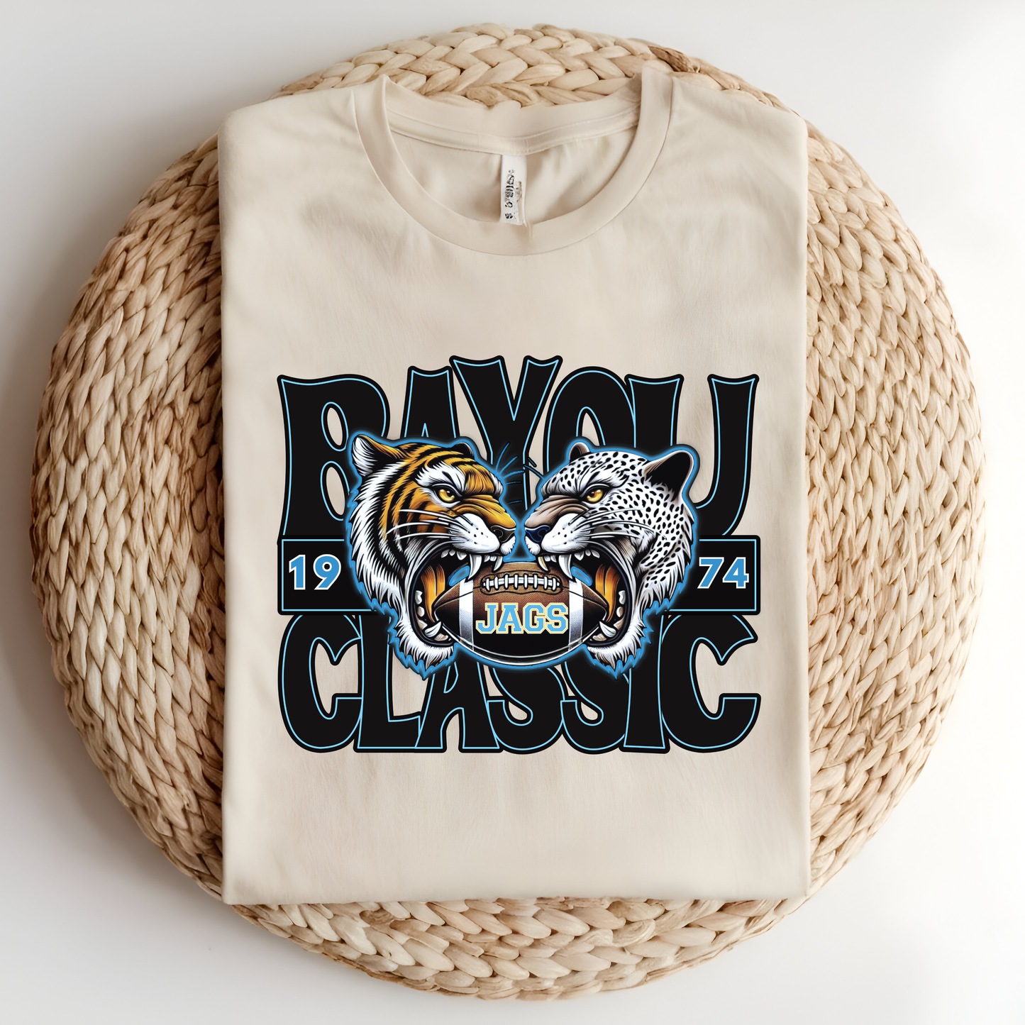 Beige sweatshirt with a graphic design featuring two roaring animals and text on a woven surface.