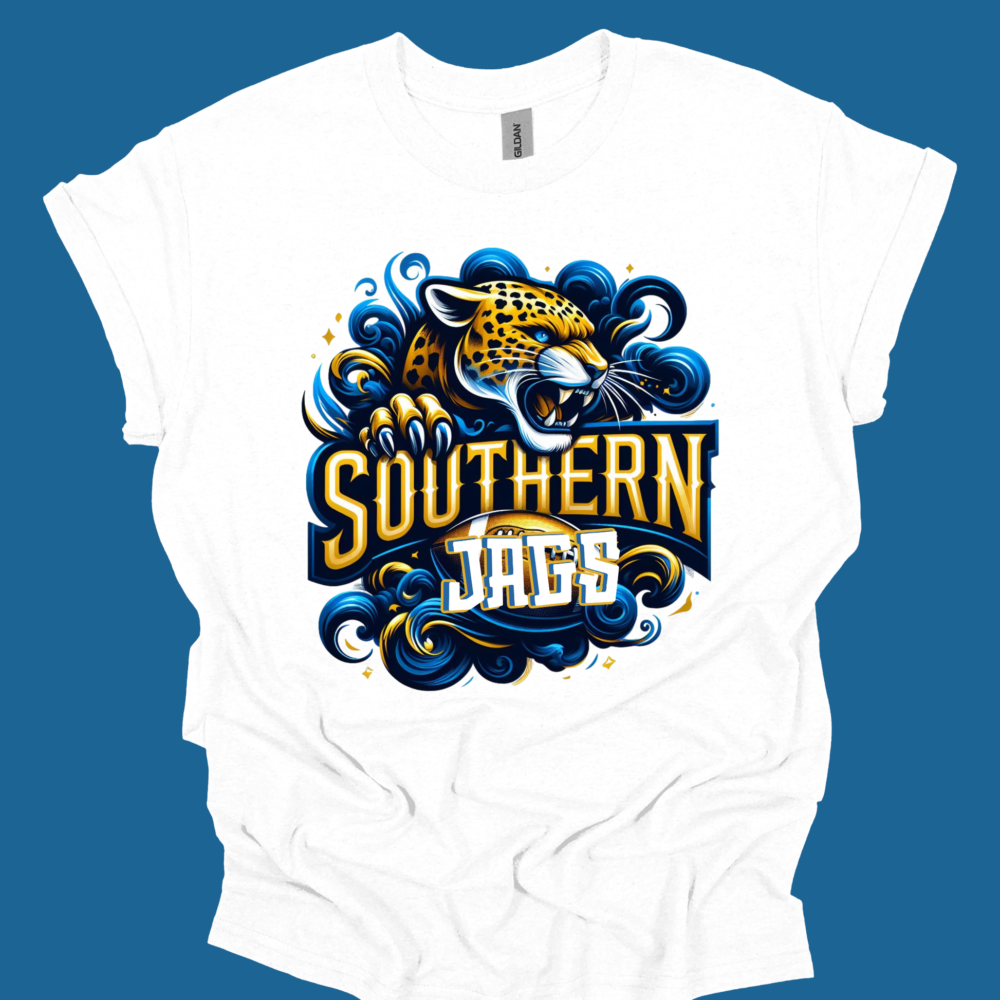 A white short-sleeve t-shirt with a graphic print of a Southern Jaguars mascot, featuring a stylized yellow and black jaguar head surrounded by blue and gold waves, with 'SOUTHERN JAGUARS' written in bold text. The shirt is displayed flat against a solid blue background.