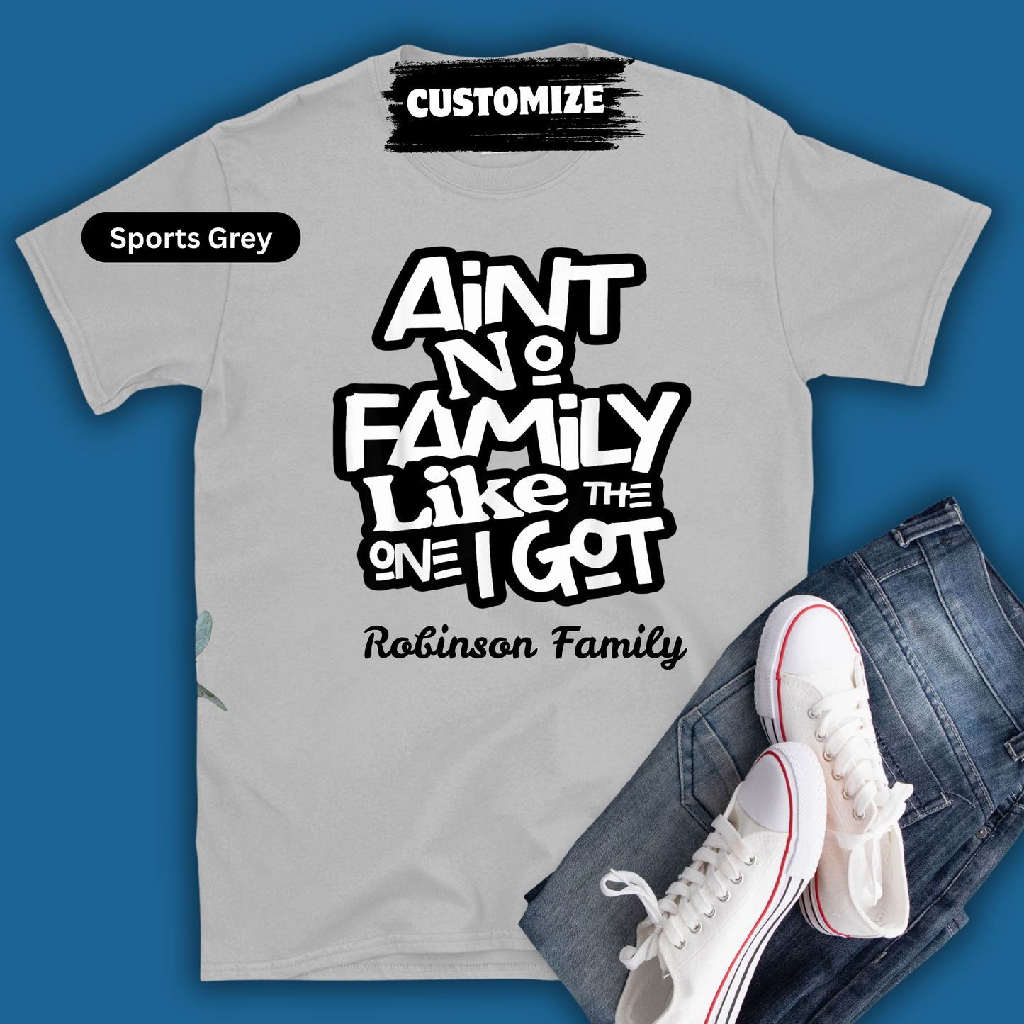 Gray t-shirt with text 'Ain't no family like the one I got' and 'Robinson Family' on a blue background.