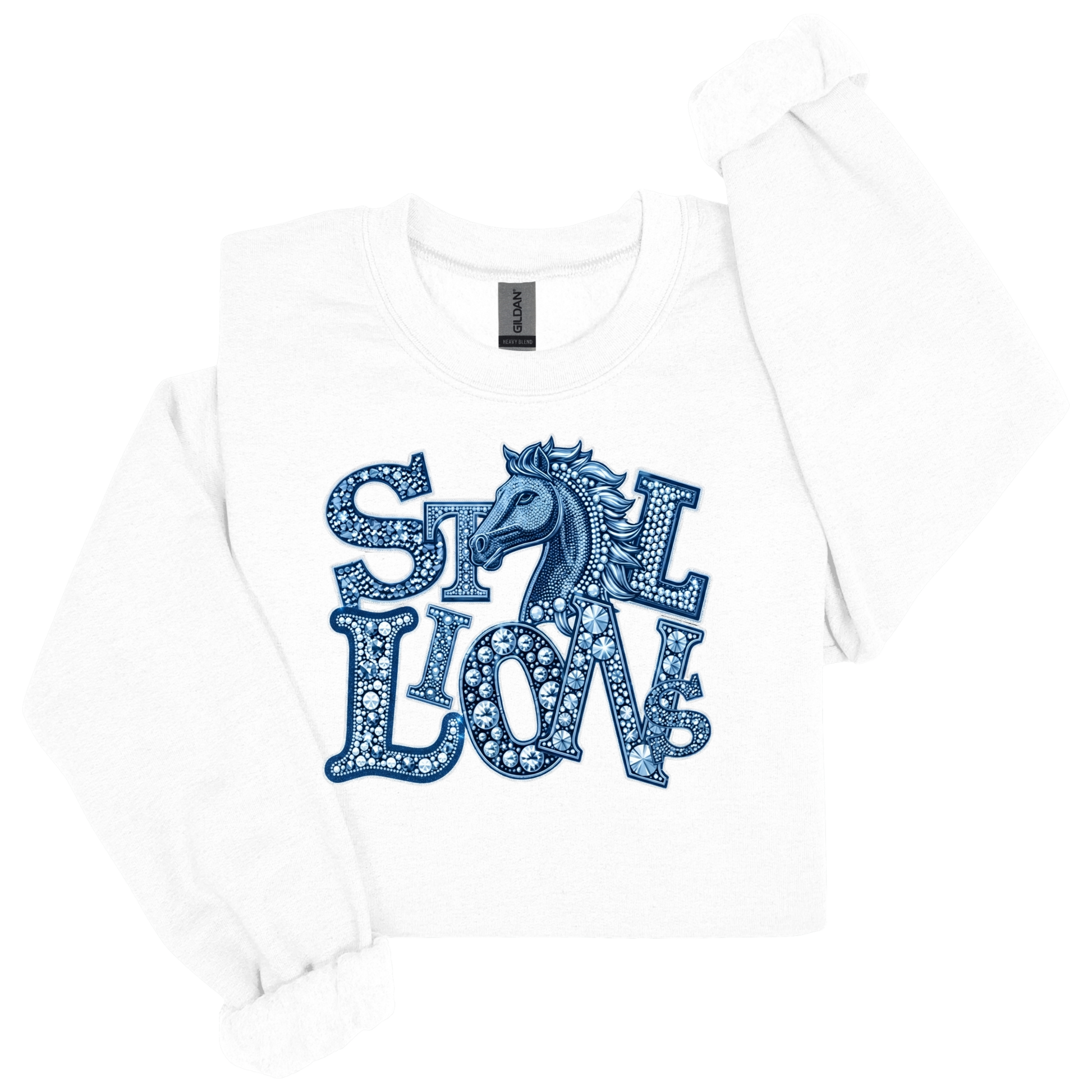 A white long-sleeve t-shirt with a blue graphic print on the front that reads 'STILL LION' in a patterned font with a horse head silhouette, shown on a white background.