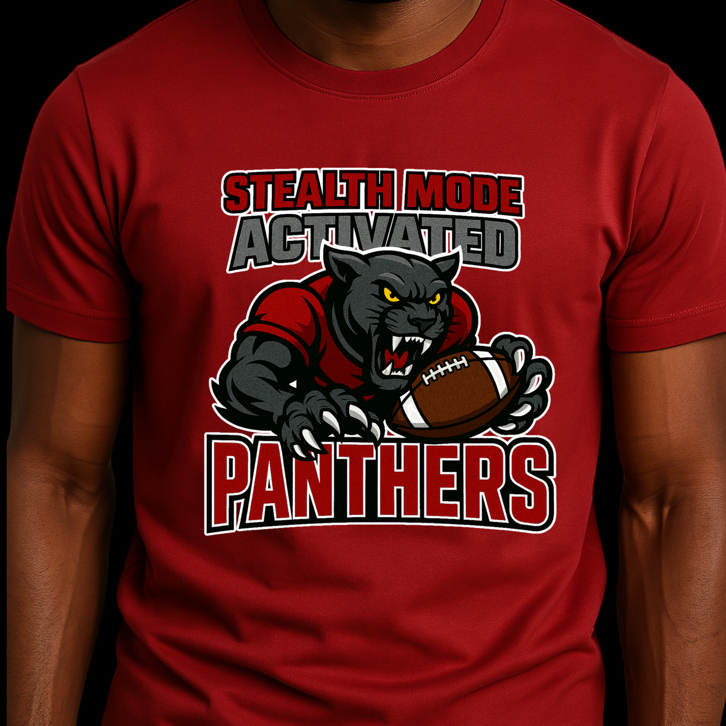 Red t-shirt with panther graphic and text 'Stealth Mode Activated Panthers' on a dark background