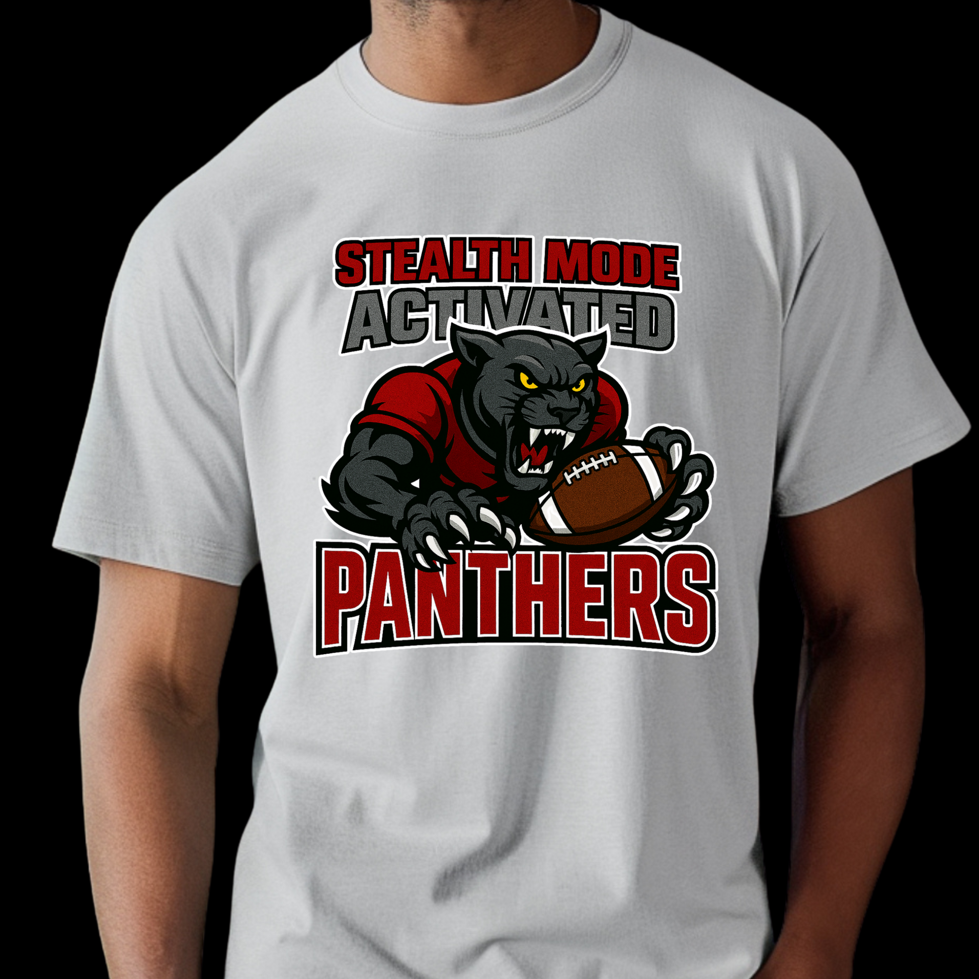 White t-shirt with panther graphic and text 'Stealth Mode Activated Panthers' on a black background