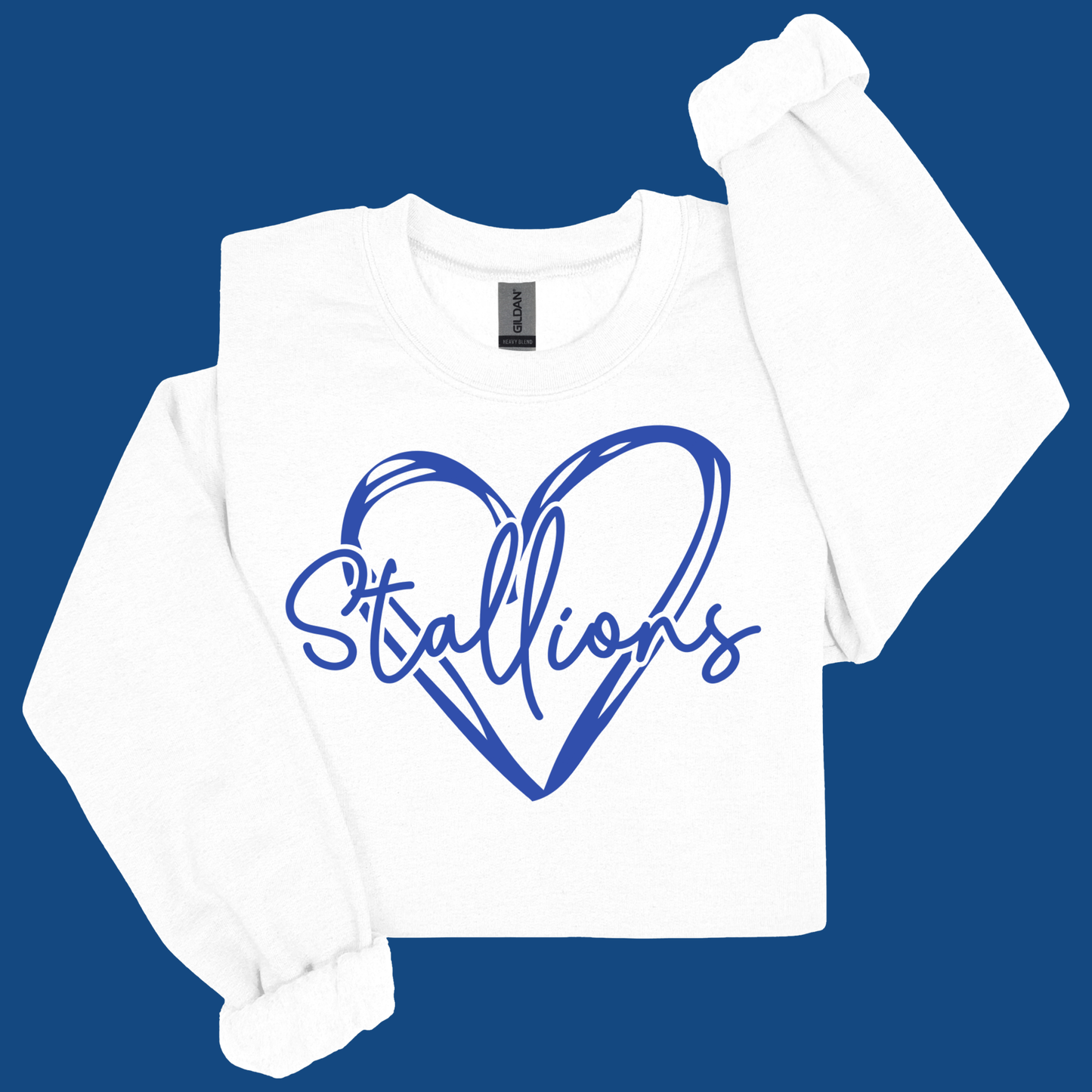 A white long-sleeve crewneck sweatshirt featuring a blue graphic of a heart outline with the word 'Stallions' written across it, displayed on a solid blue background.