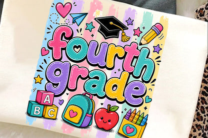A white canvas tote bag featuring a colorful 'Fourth Grade' graphic print with school-themed illustrations like a graduation cap, pencil, backpack, apple, and blocks, laid flat on a soft surface.