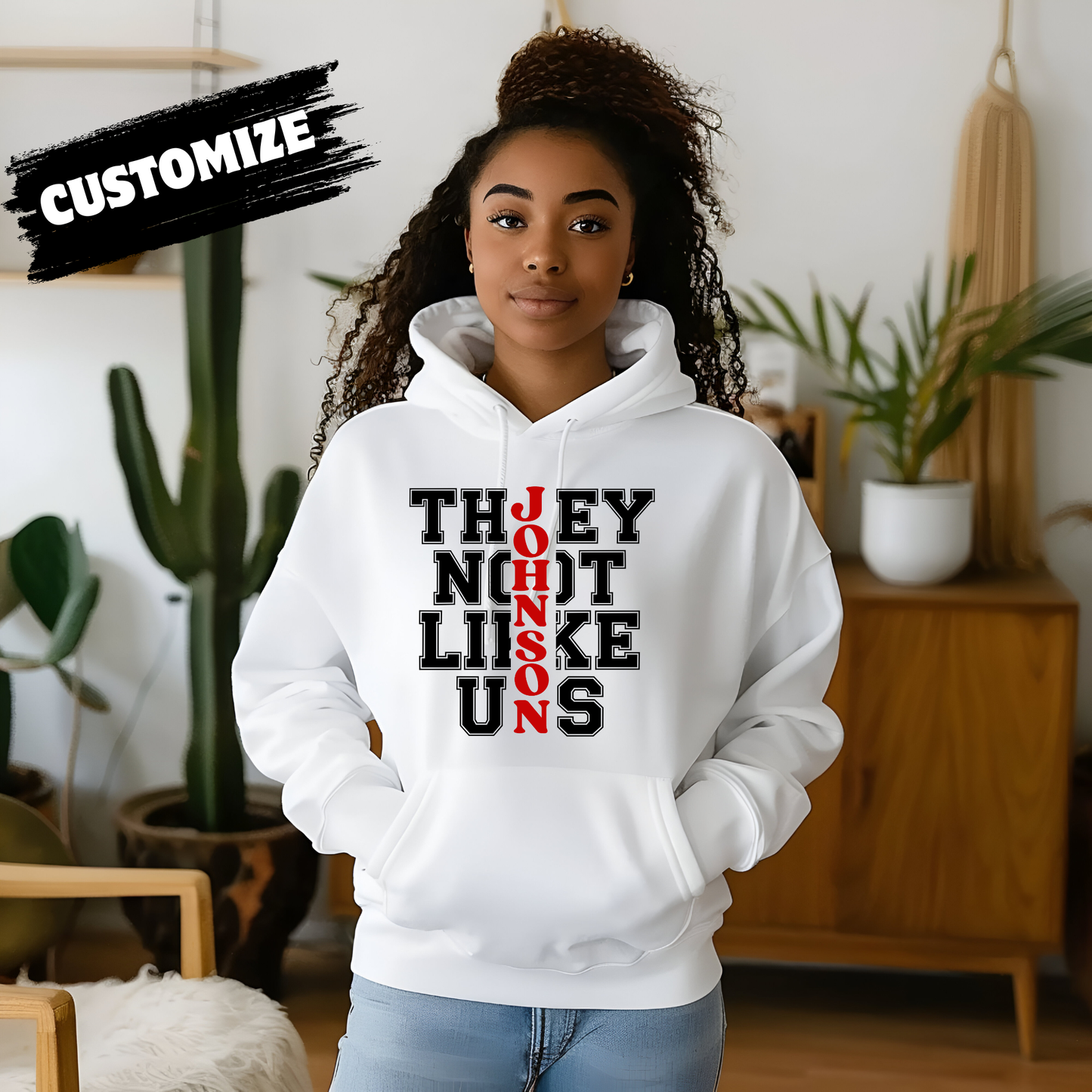 Person wearing a white hoodie with text in a room with plants Family Reunion Hoodie - They Not Like Us - Custom Family Name Matching Hoodie