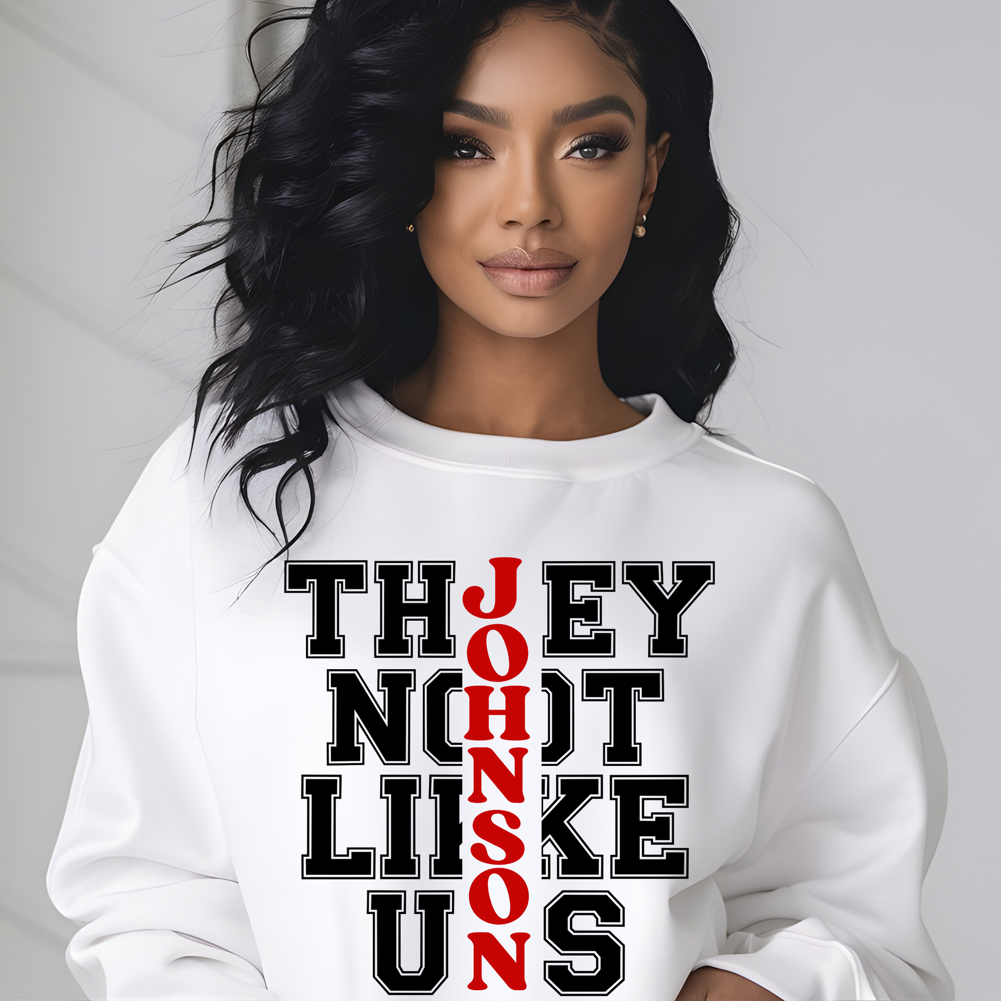 Woman wearing a white sweatshirt with text design on a plain background