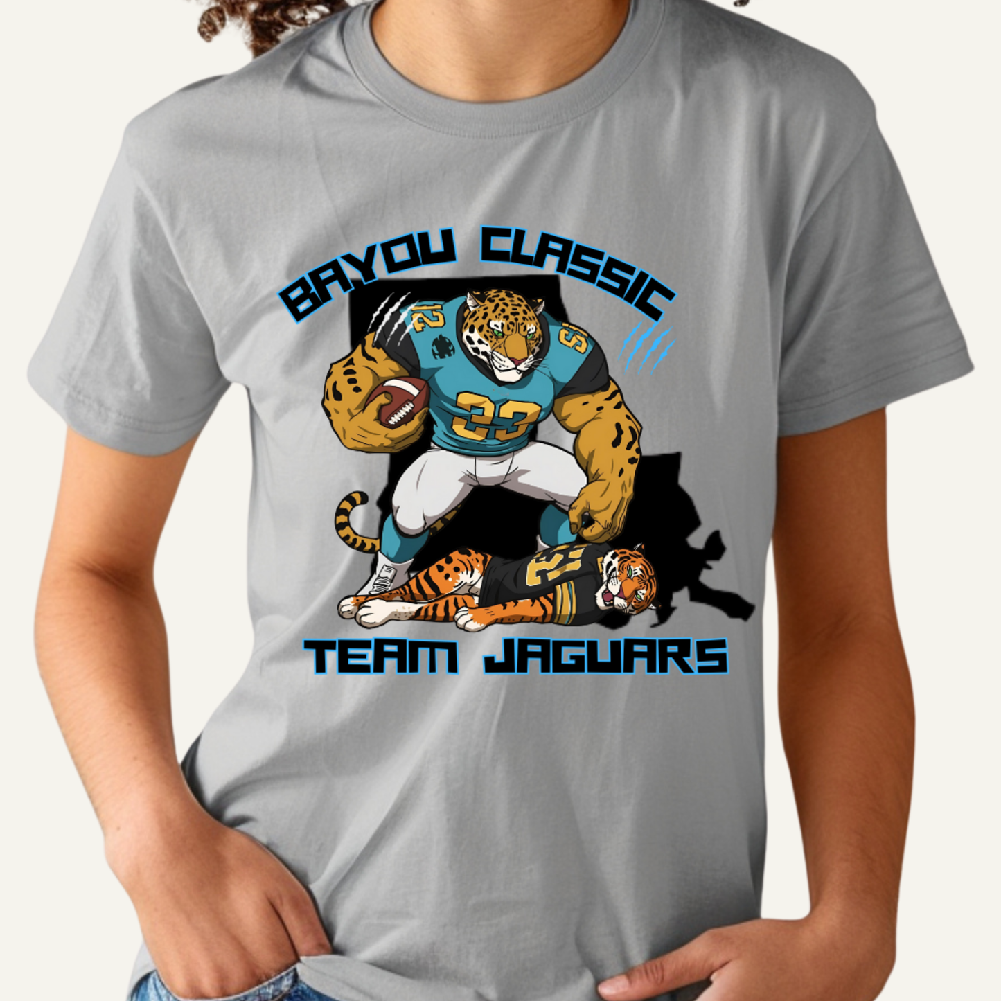 Gray t-shirt with 'Bavou Classic Team Jaguars' graphic design featuring a tiger and football player.  Bayou Classic Team Jaguars: Bayou Classic Team Jaguars Game Day T-Shirt