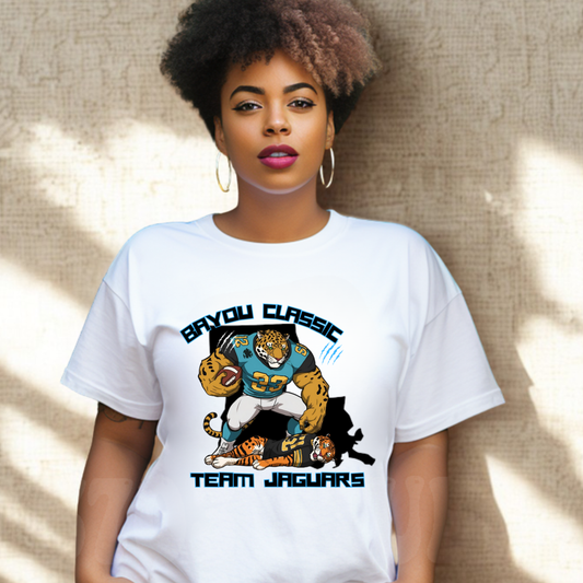 Woman wearing a white t-shirt with 'Bayou Classic Team Jaguars' design against a textured wall. Bayou Classic Team Jaguars: Bayou Classic Team Jaguars Game Day T-Shirt
