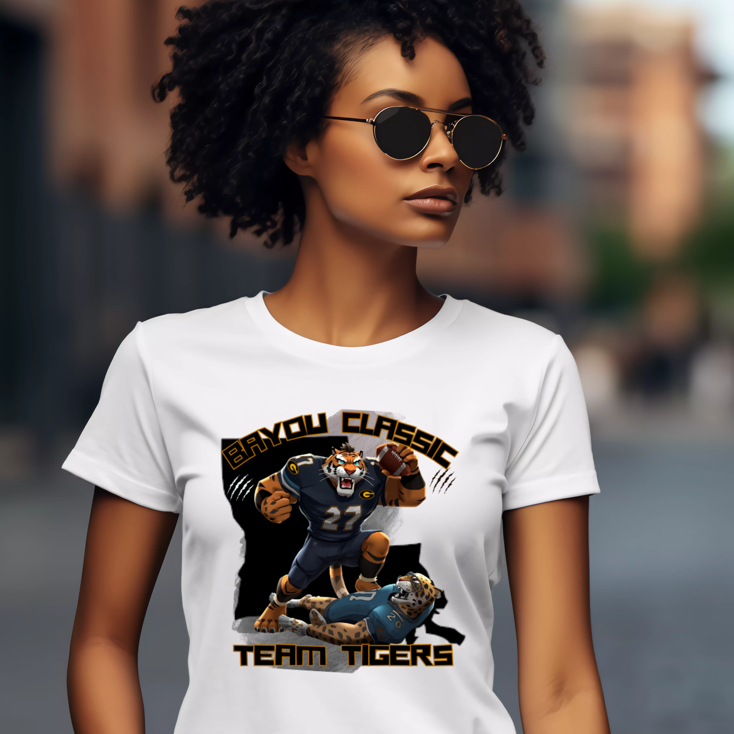 Woman wearing a white t-shirt with 'BAYOU CLASSIC' and 'TEAM TIGERS' design.  Bayou Classic Team Tigers: Grambling Tigers Bayou Classic Game Day T-Shirt
