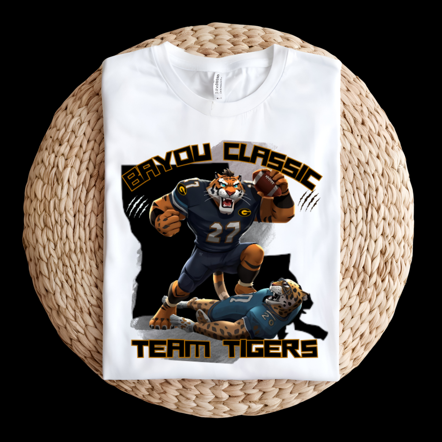 White t-shirt with 'Bayou Classic Team Tigers' graphic on a woven surface  Bayou Classic Team Tigers: Grambling Tigers Bayou Classic Game Day T-Shirt