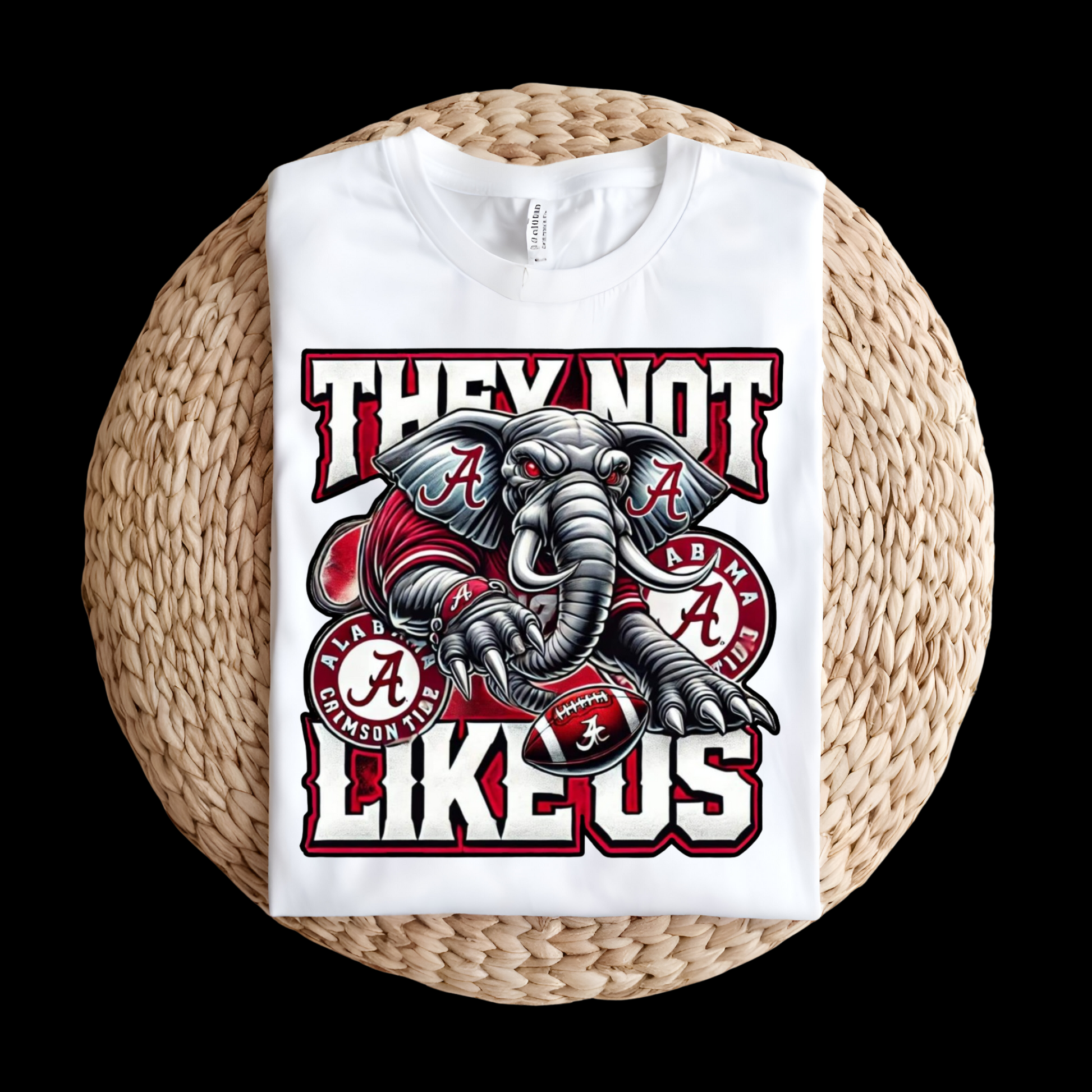 White sweatshirt with elephant graphic and text on a woven surface Alabama Football "They Not Like Us" Alabama Crimson Tide T-Shirt