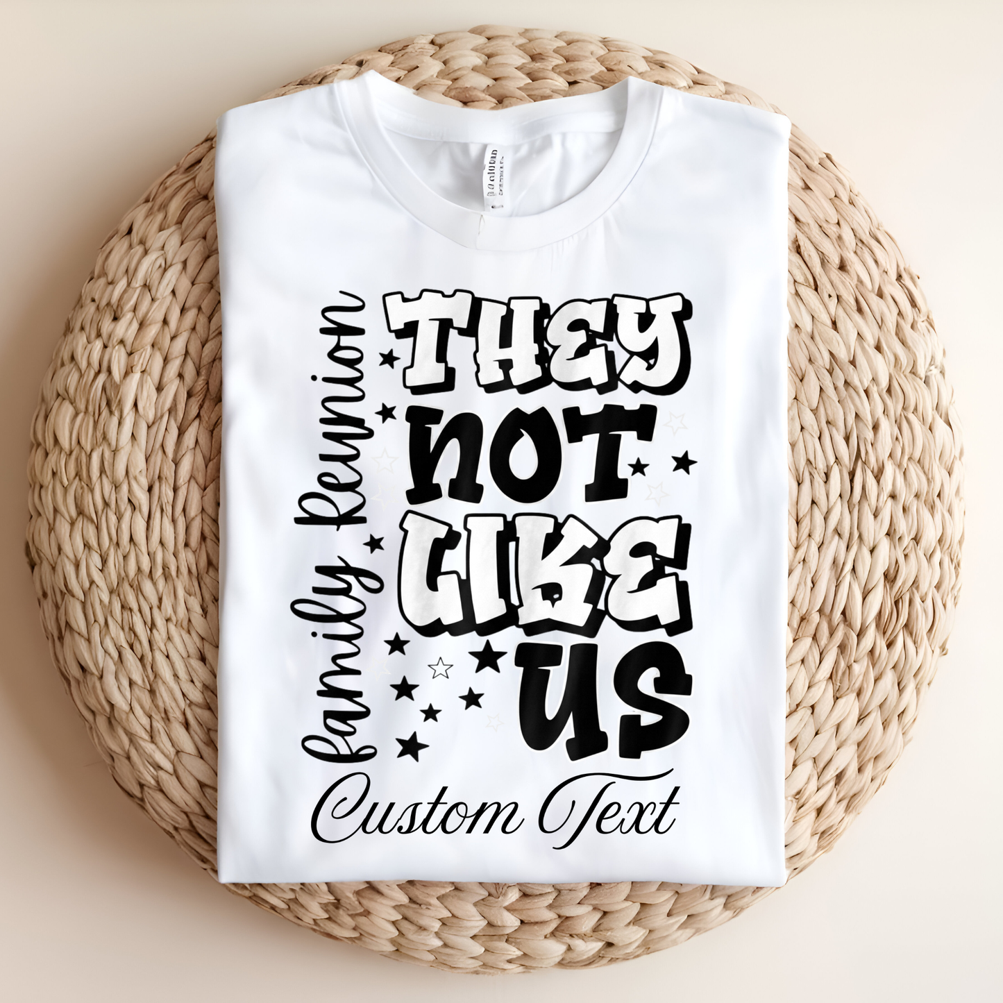 White t-shirt with black text on a woven mat