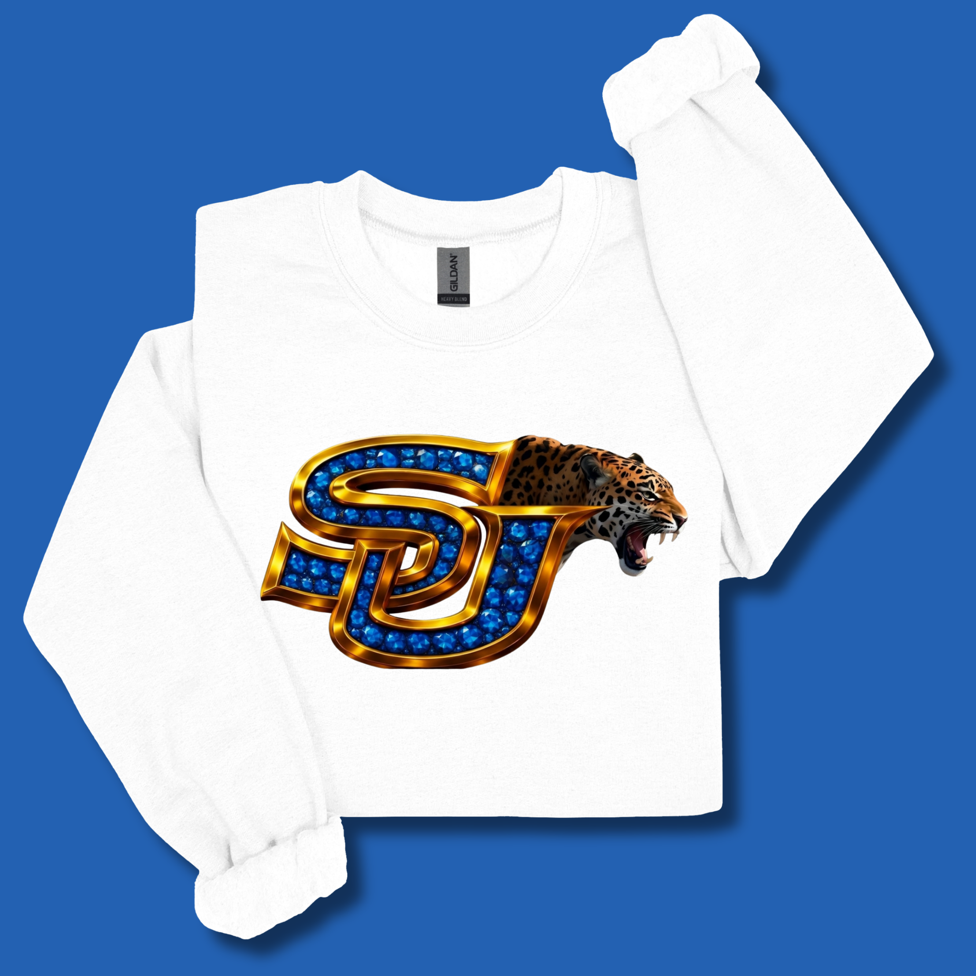 A white long-sleeve sweatshirt with a graphic of a roaring leopard and the letters 'SJ' filled with blue gems, displayed on a solid blue background.