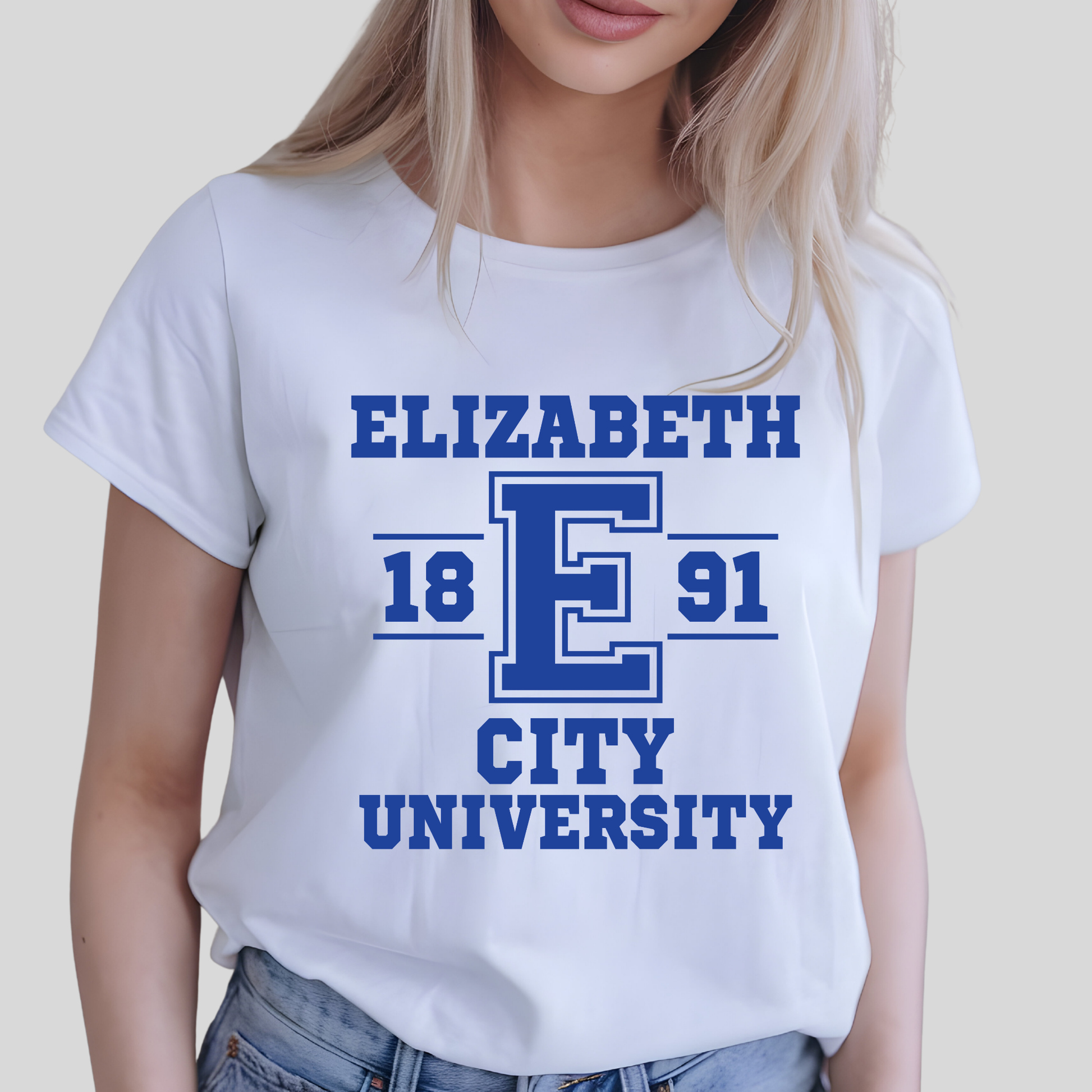 A woman wearing a white short-sleeve t-shirt with a blue collegiate-style graphic that reads 'ELIZABETH 18 E 91 CITY UNIVERSITY'.