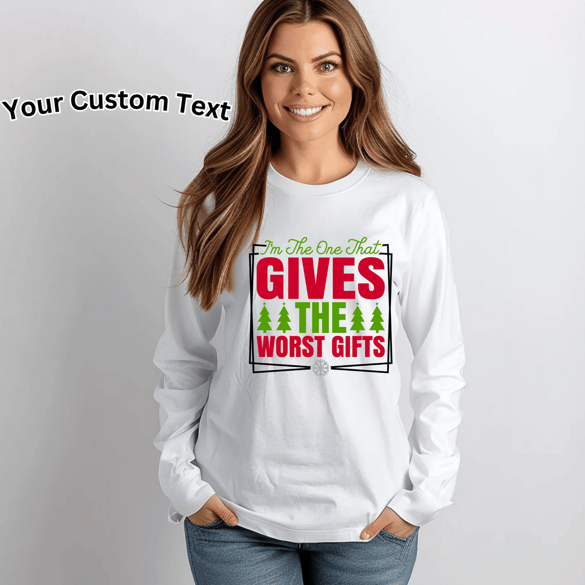 A woman wearing a white long-sleeve t-shirt with a humorous Christmas graphic that reads 'I'm The One That GIVES THE WORST GIFTS' in red and green text with pine tree icons. The image has a light gray background and a text overlay in the top left that says 'Your Custom Text'.