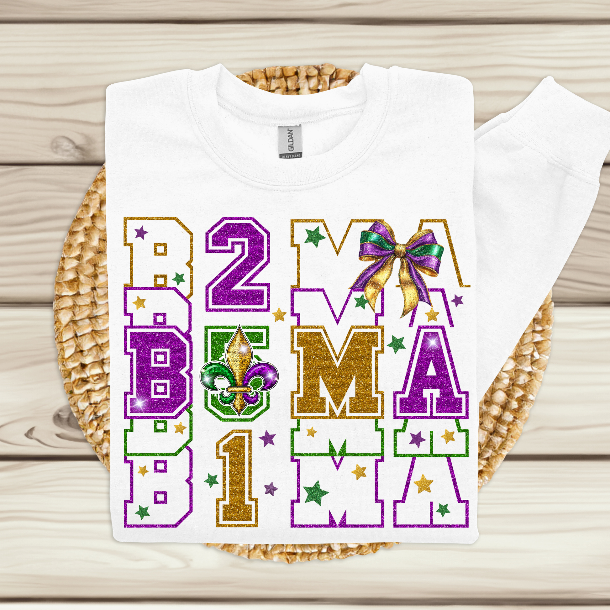 White t-shirt with colorful text and graphics on a woven mat