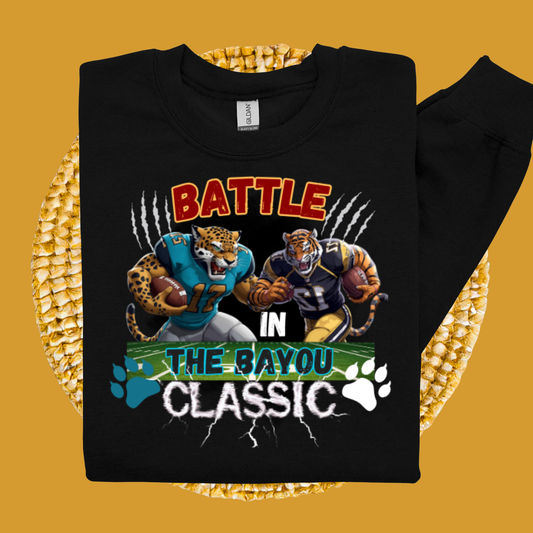 Black sweatshirt with sports-themed design featuring leopards and tigers on a yellow background  Bayou Classic: Battle in the Bayou Classic Game Day Unisex Sweater