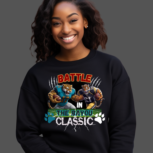 Person wearing a black sweatshirt with 'Battle in the Bayou Classic' graphic design.  Bayou Classic: Battle in the Bayou Classic Game Day Unisex Sweater