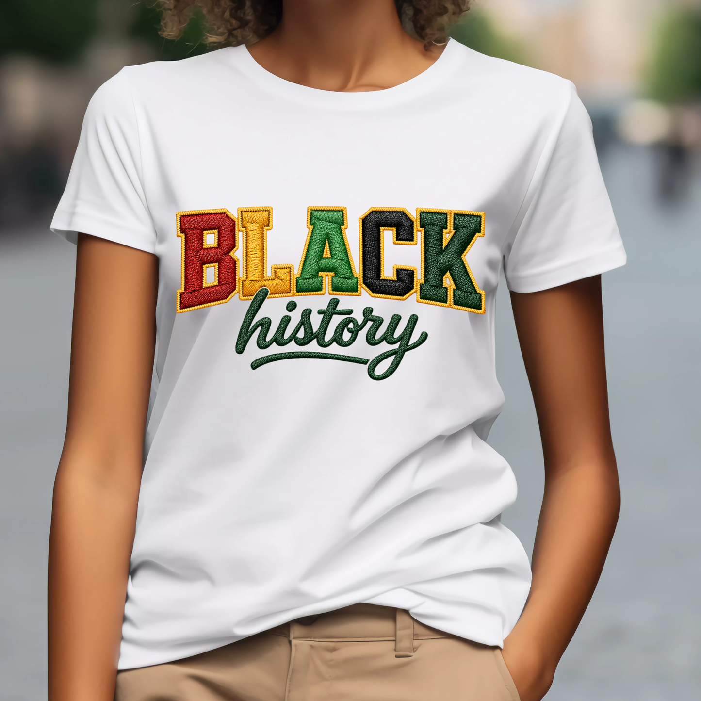 Person wearing a white t-shirt with 'BLACK history' in multicolor text.
