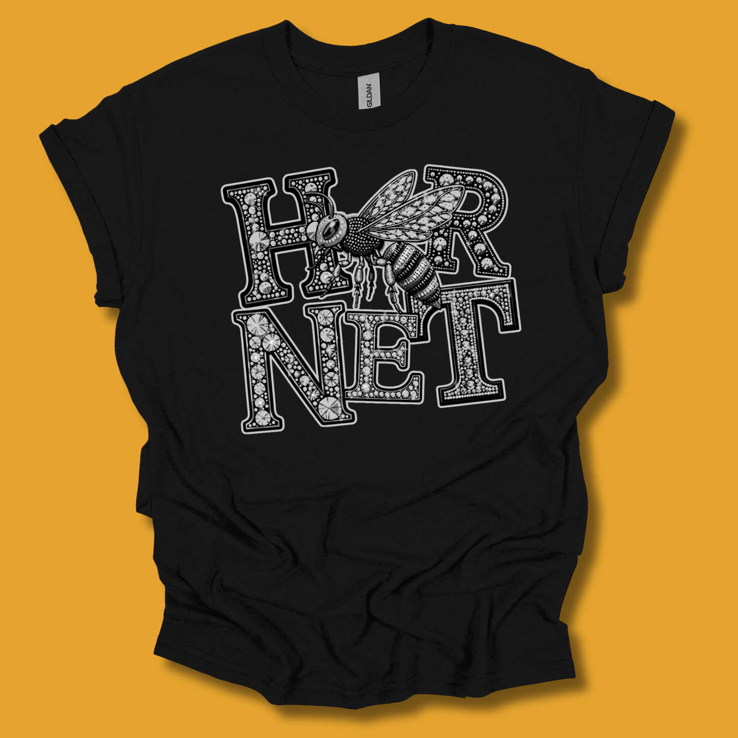 A black short-sleeve t-shirt with a white graphic print reading 'HONET' in ornate letters with a honeybee design, displayed on a solid orange background.