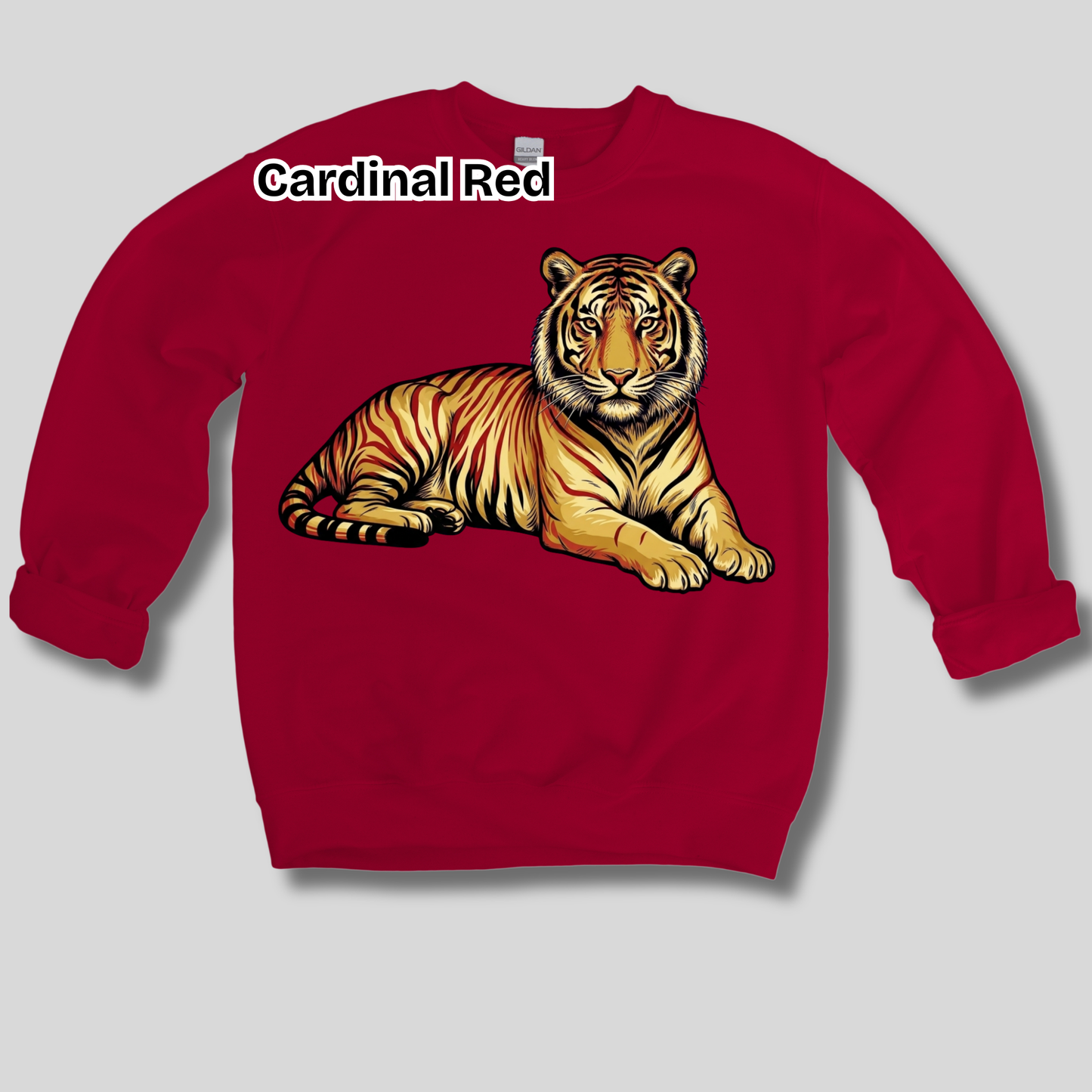 A red crewneck sweatshirt featuring a graphic of a lying tiger on the front, with the text 'Cardinal Red' printed above the graphic, displayed on a light gray background.