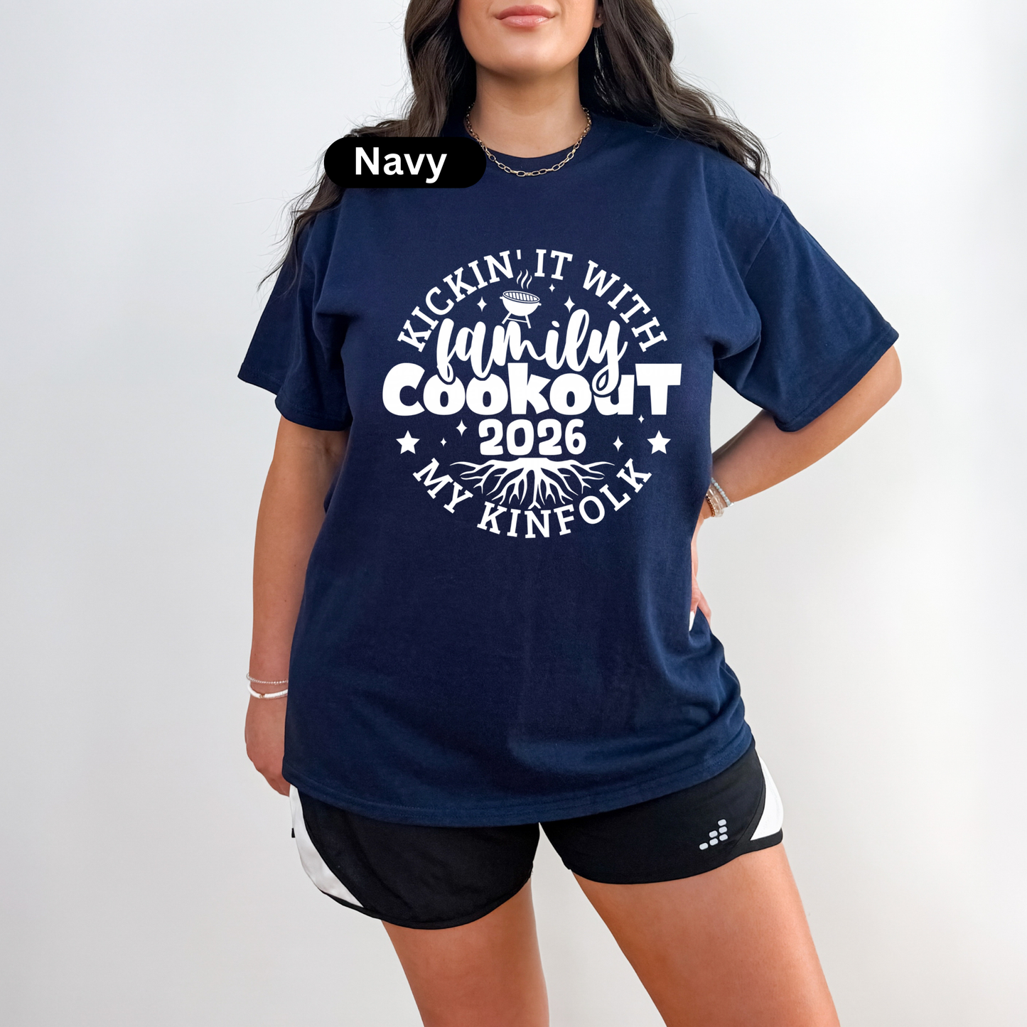 Navy t-shirt with white text worn by a person on a white background