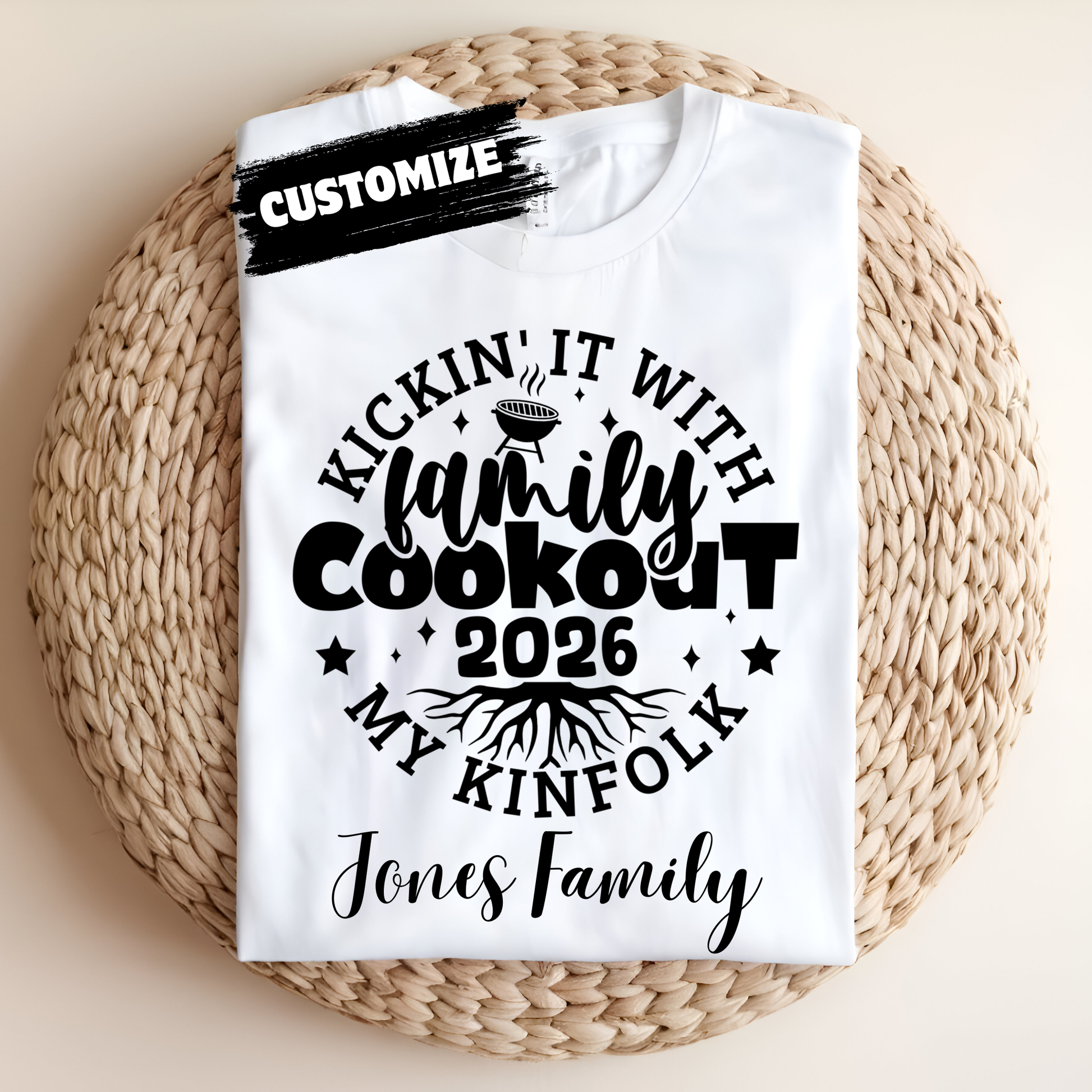 White t-shirt with black text and design on a woven mat