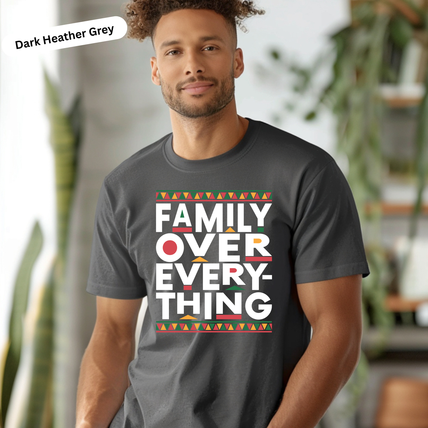 Man wearing a dark Heather Grey t-shirt with 'Family Over Everything' text