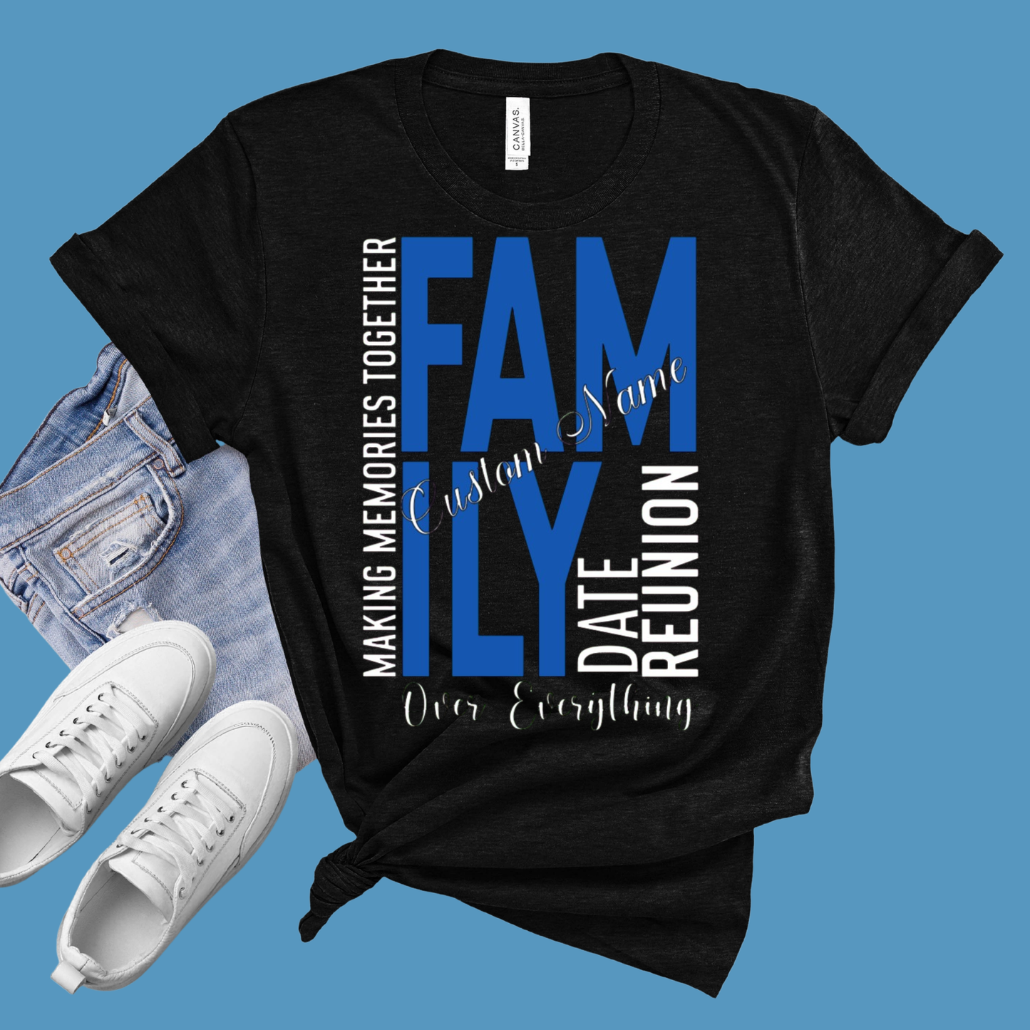 Black t-shirt with family reunion text design on a blue background with jeans and white sneakers.