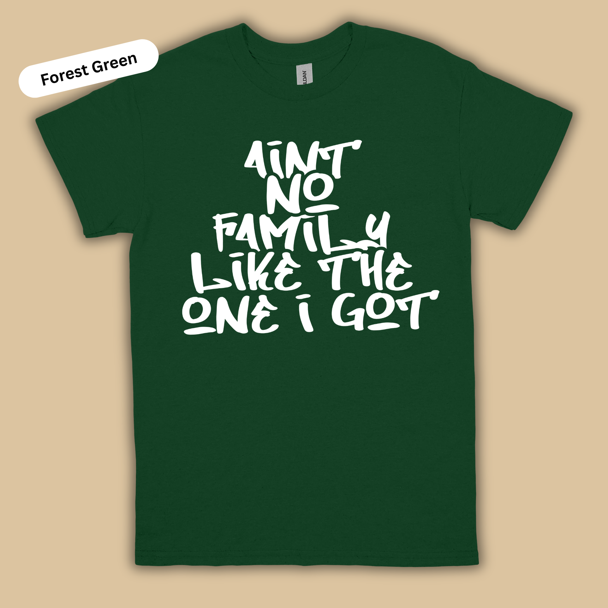 Forest green t-shirt with white text on a beige background