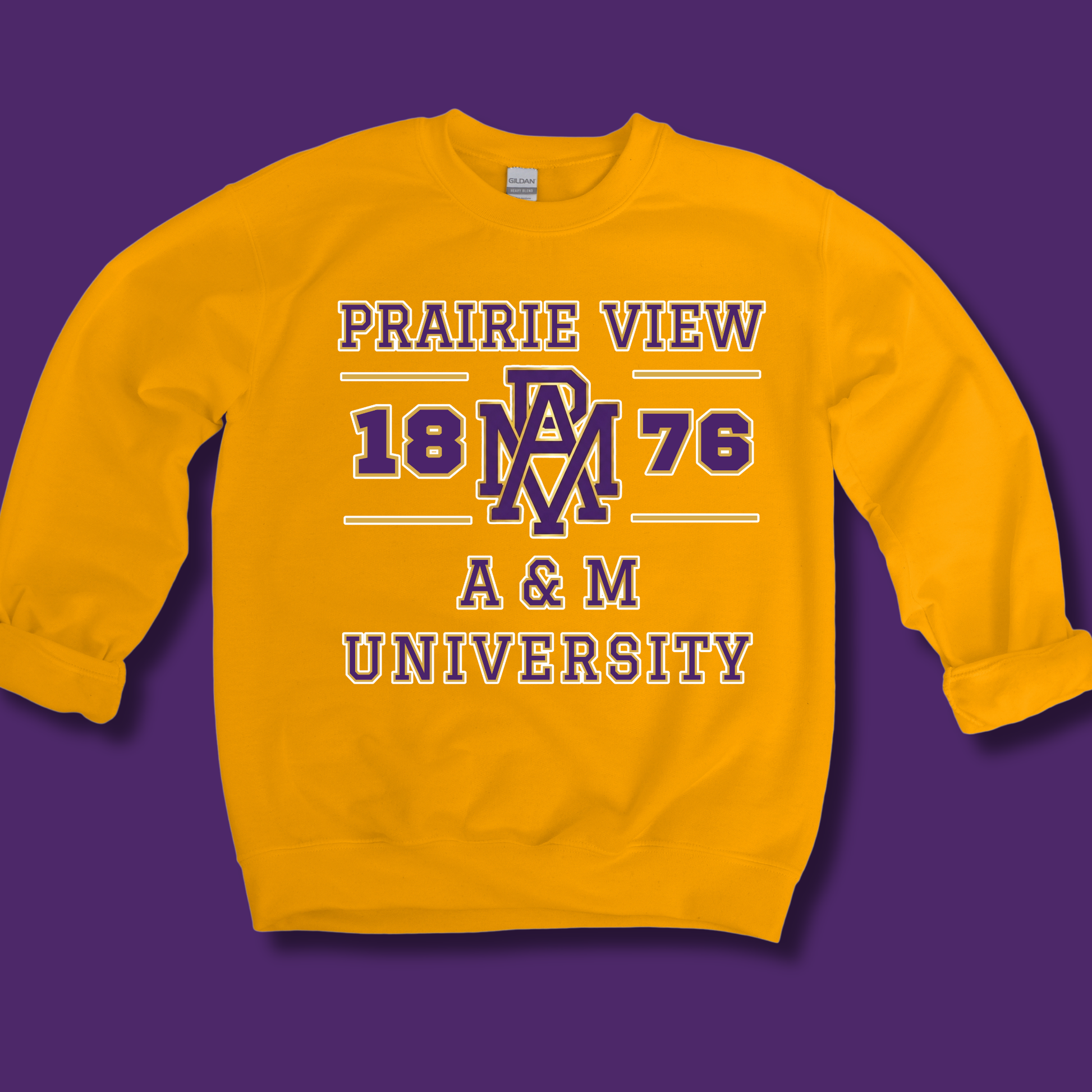 A yellow crewneck sweatshirt with a purple and white graphic print reading 'PRAIRIE VIEW 1876 A & M UNIVERSITY' on a solid purple background.