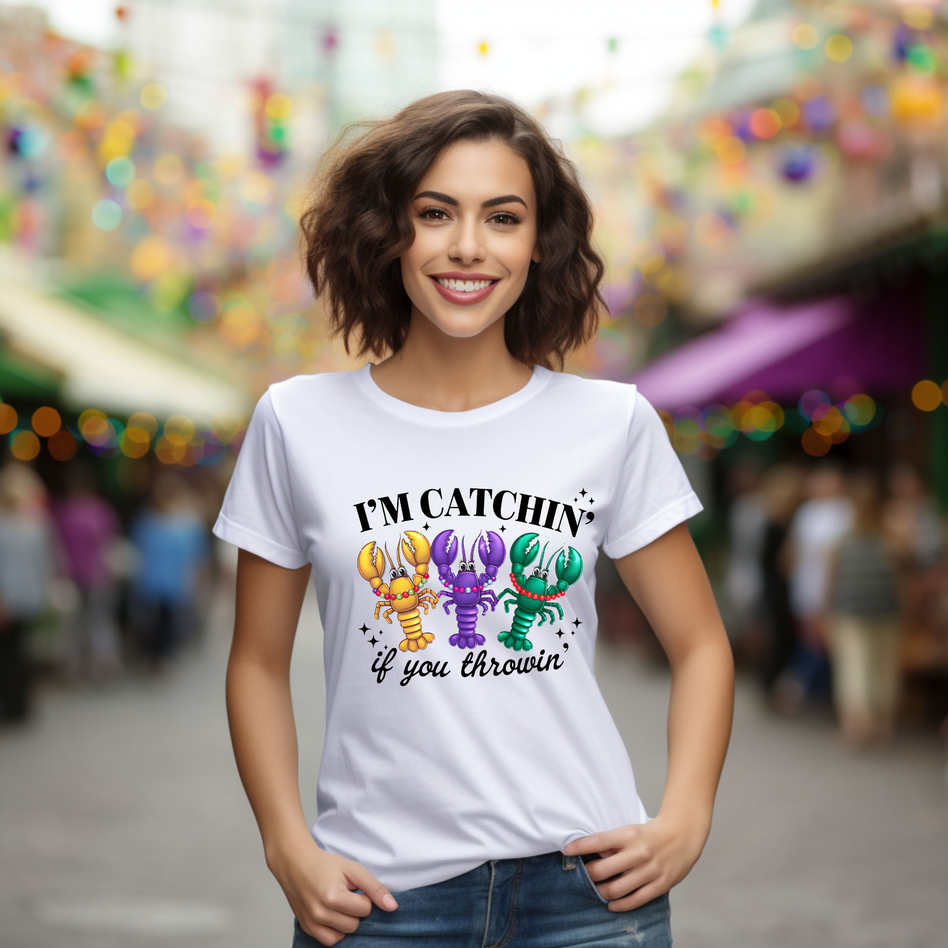 Woman wearing a white t-shirt with colorful lobster design and text in an outdoor setting.
