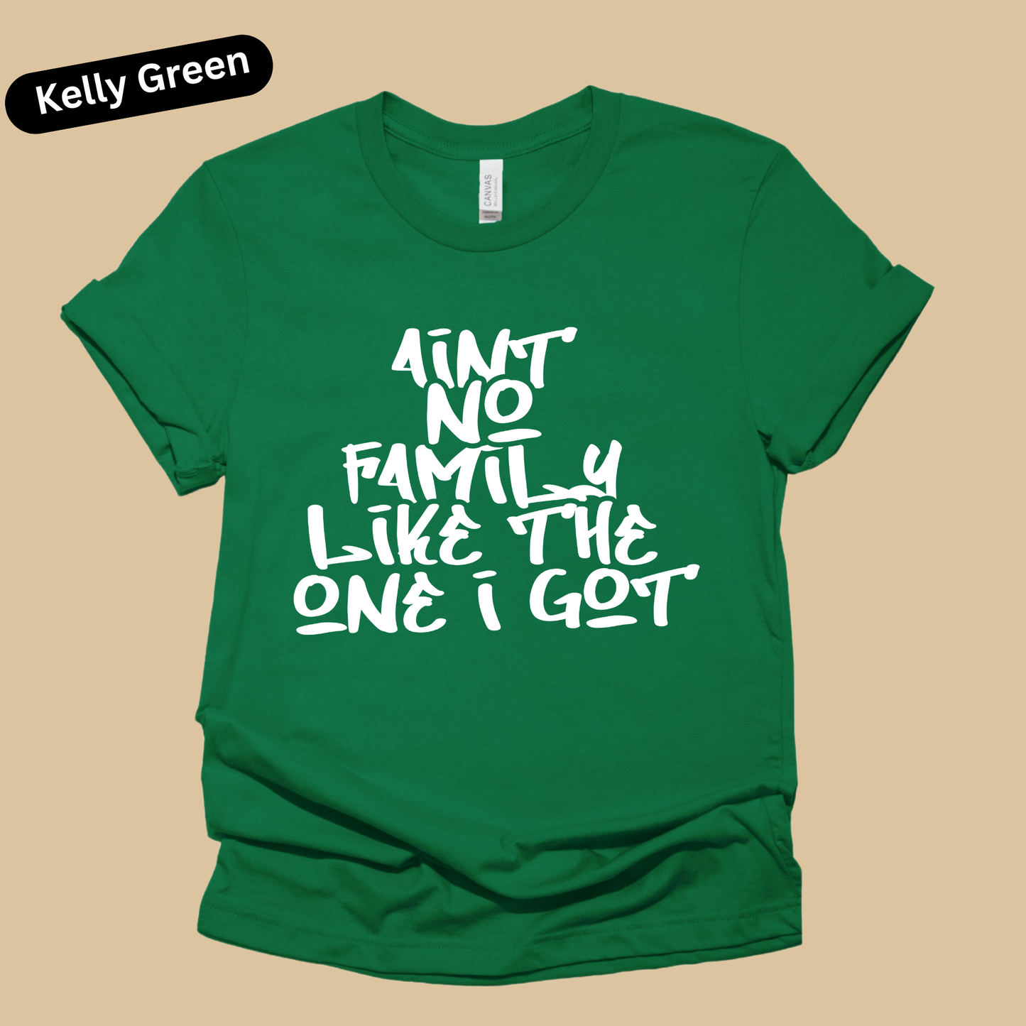 Green t-shirt with white text on a beige background