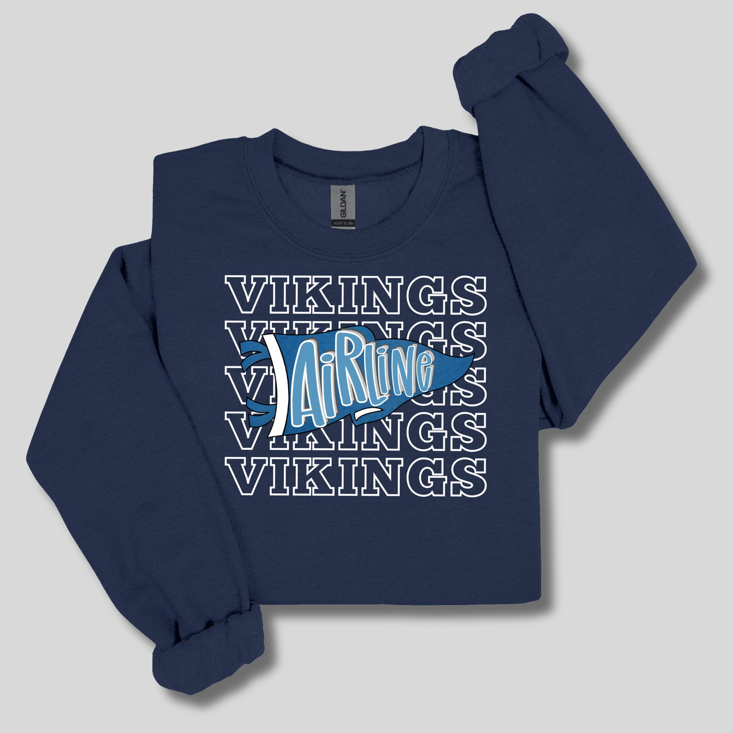 A navy blue long-sleeve sweatshirt with a graphic print on the front. The design features the word 'VIKINGS' repeated in white outline text, overlaid with a light blue Viking ship and the word 'AirRug' in white script.