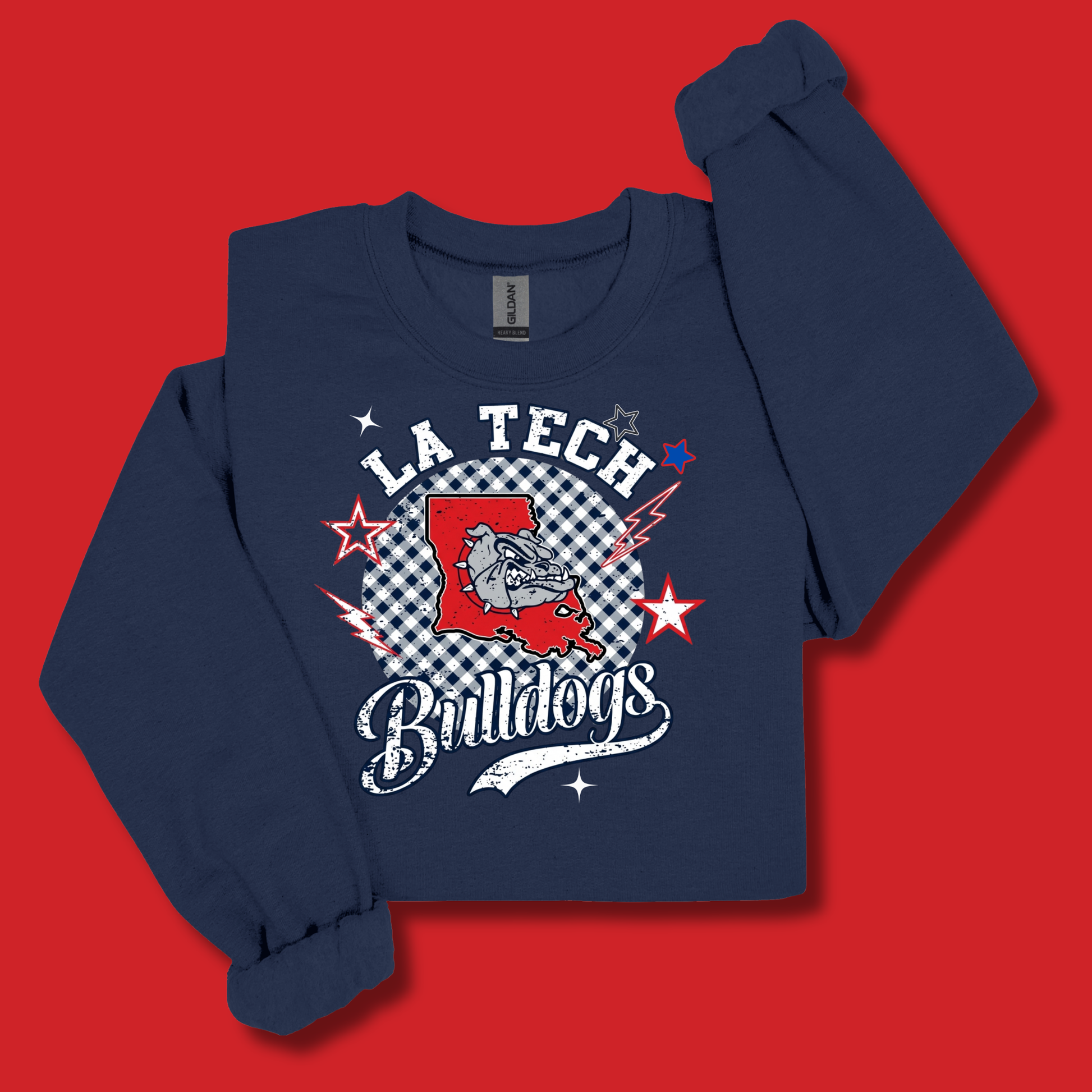A navy blue long-sleeve sweatshirt with a 'LA Tech Bulldogs' graphic on the front, displayed flat against a solid red background.
