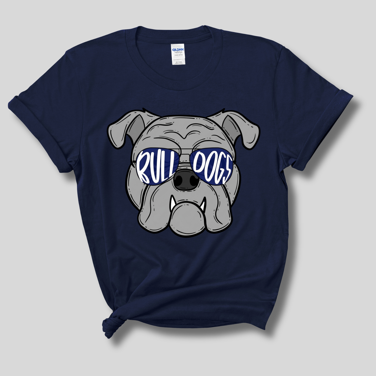 A navy blue Gildan t-shirt with a graphic of a bulldog wearing blue sunglasses that say 'RULL DOGS' in white. The t-shirt is displayed flat against a light gray background.