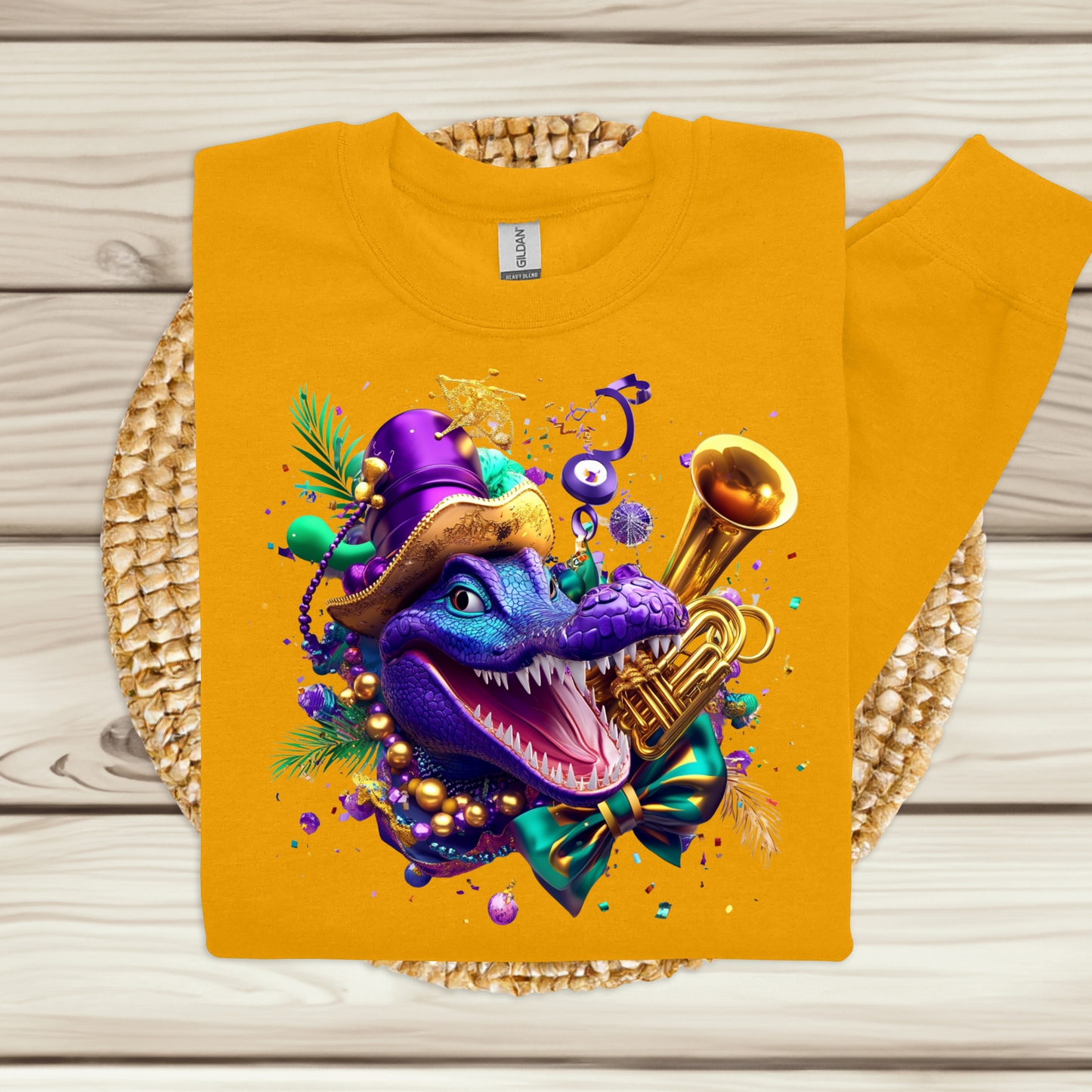 Yellow sweatshirt with a colorful dragon design on a wooden surface