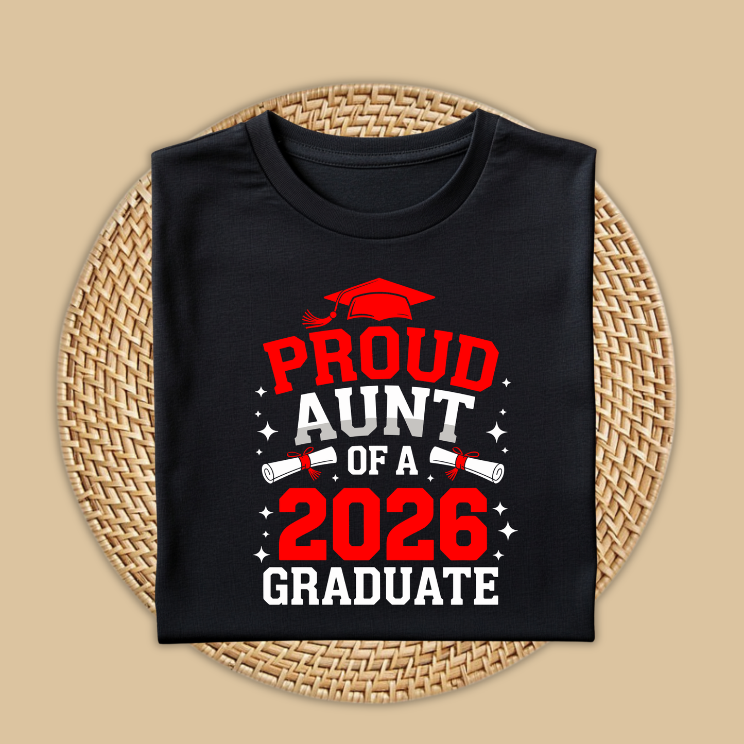 Black t-shirt with 'Proud Aunt of a 2026 Graduate' text on a woven mat