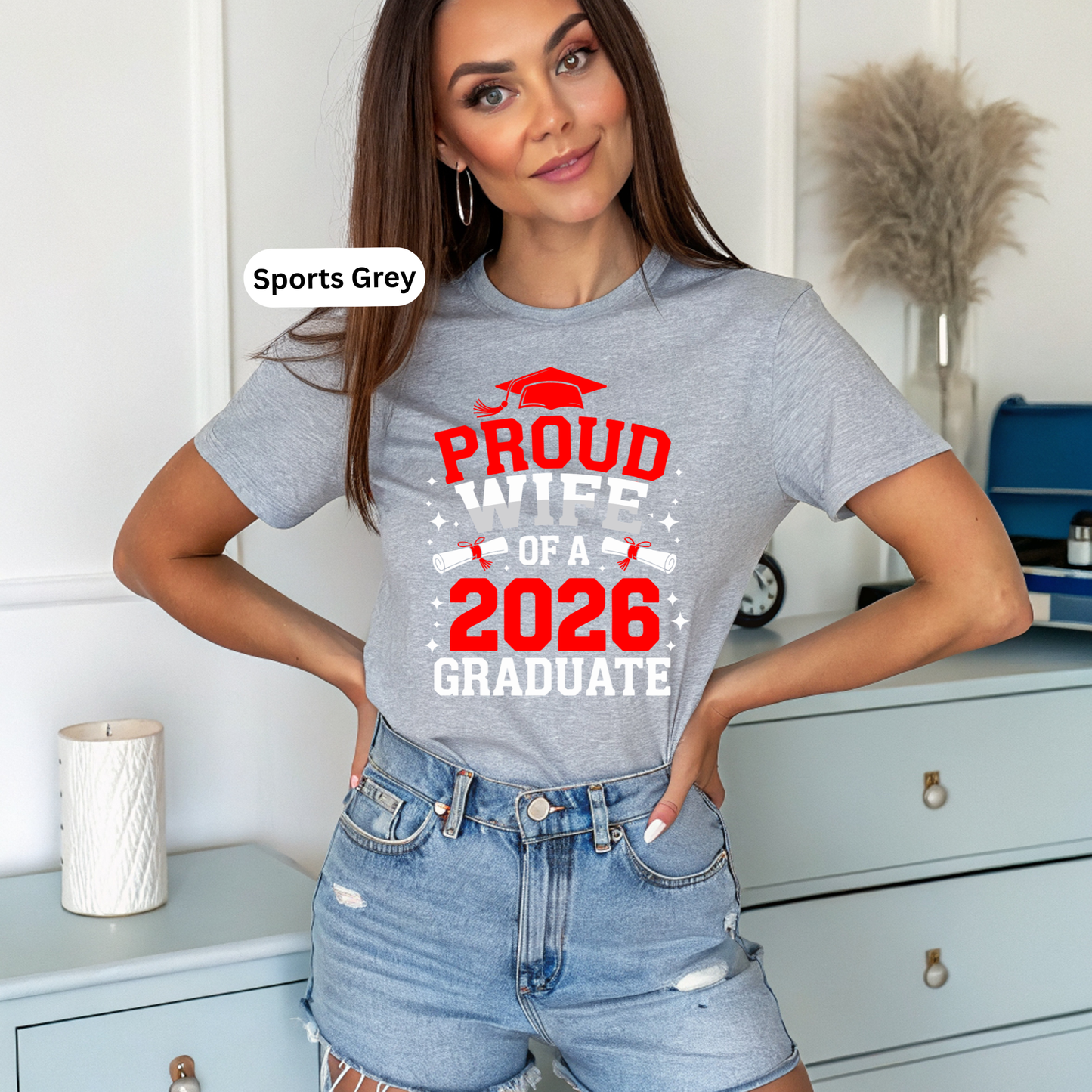 Woman wearing a 'Proud Parent of a 2026 Graduate' t-shirt in a casual setting.
