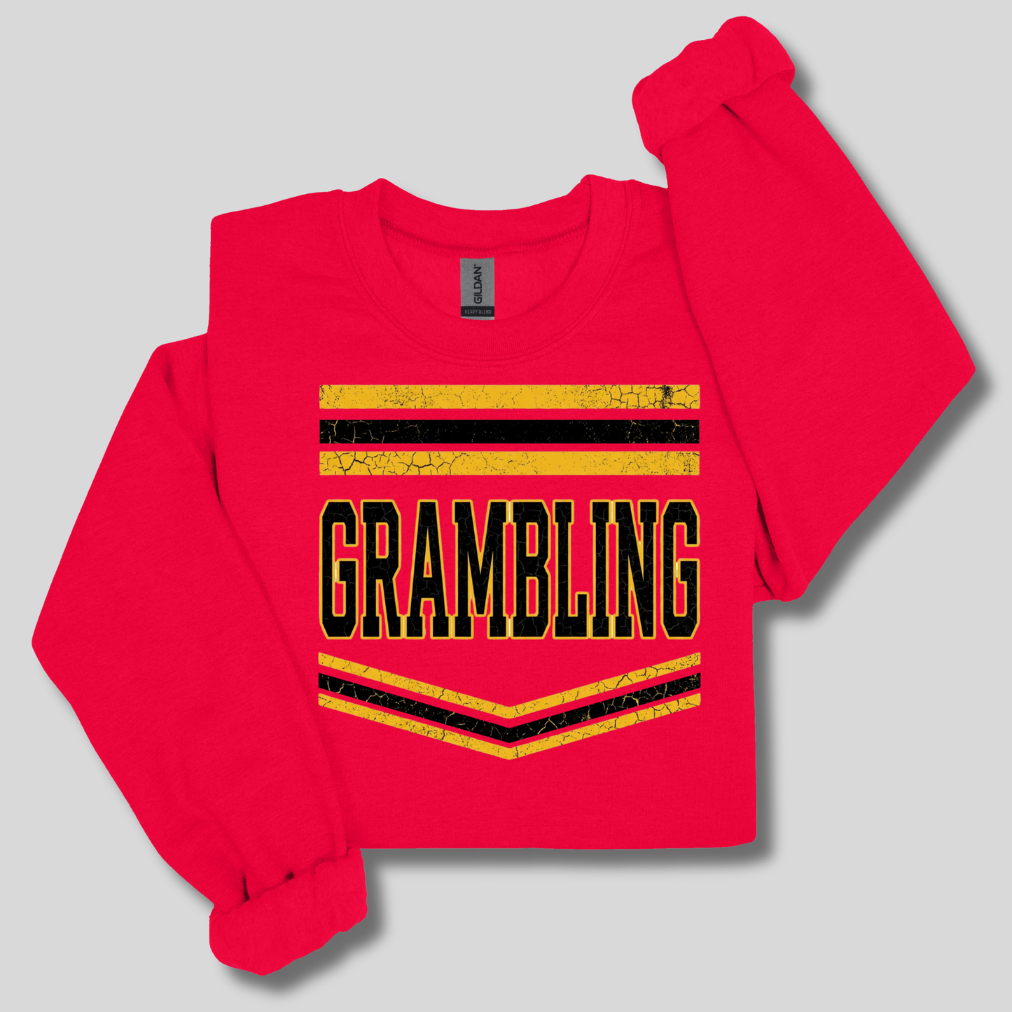 A bright red long-sleeve sweatshirt with a graphic print on the front. The design features the word 'Woodland' in a stylized red, white, and blue font layered over a repeating white outline text pattern that reads 'KNIGHTS'.
