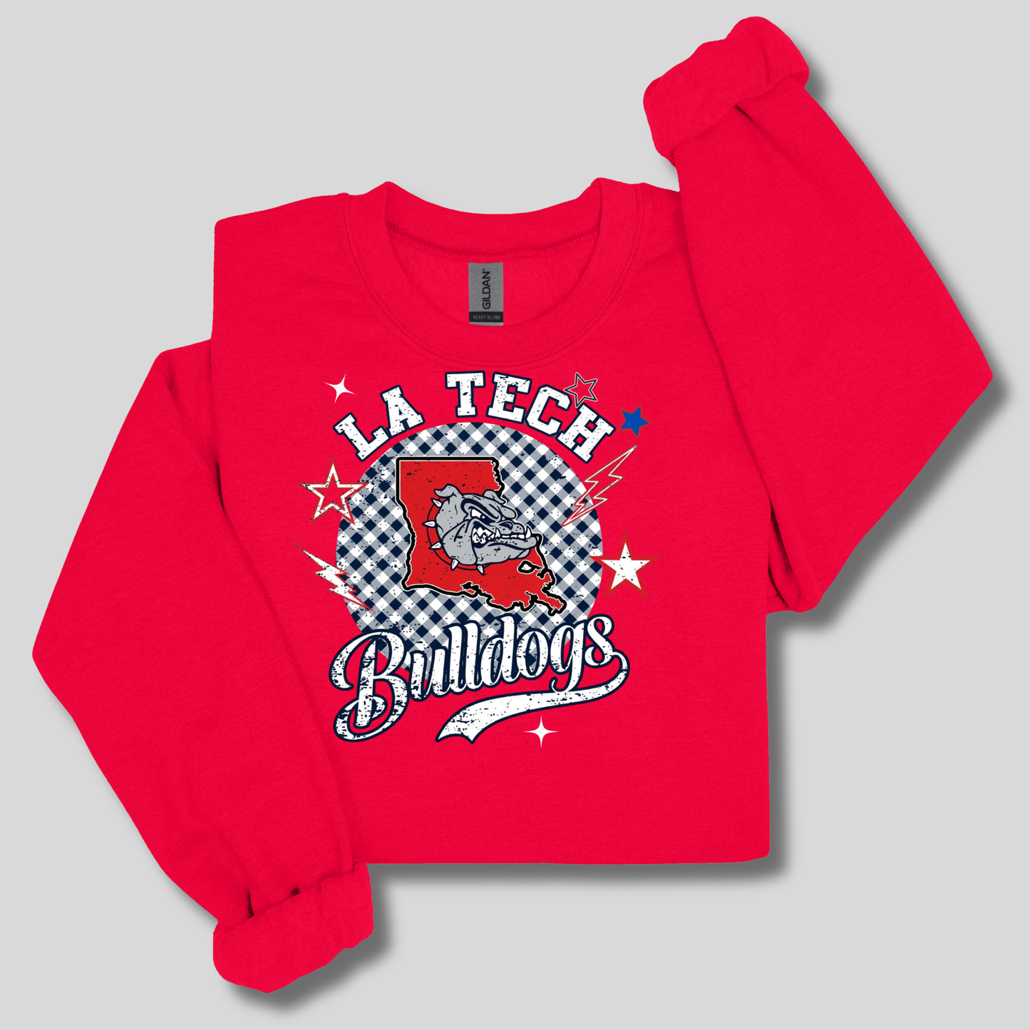 A bright red long-sleeve sweatshirt with a distressed collegiate-style graphic on the front. The graphic features the word 'GRAMBLING' in black varsity letters outlined in yellow, framed by yellow and black stripes.