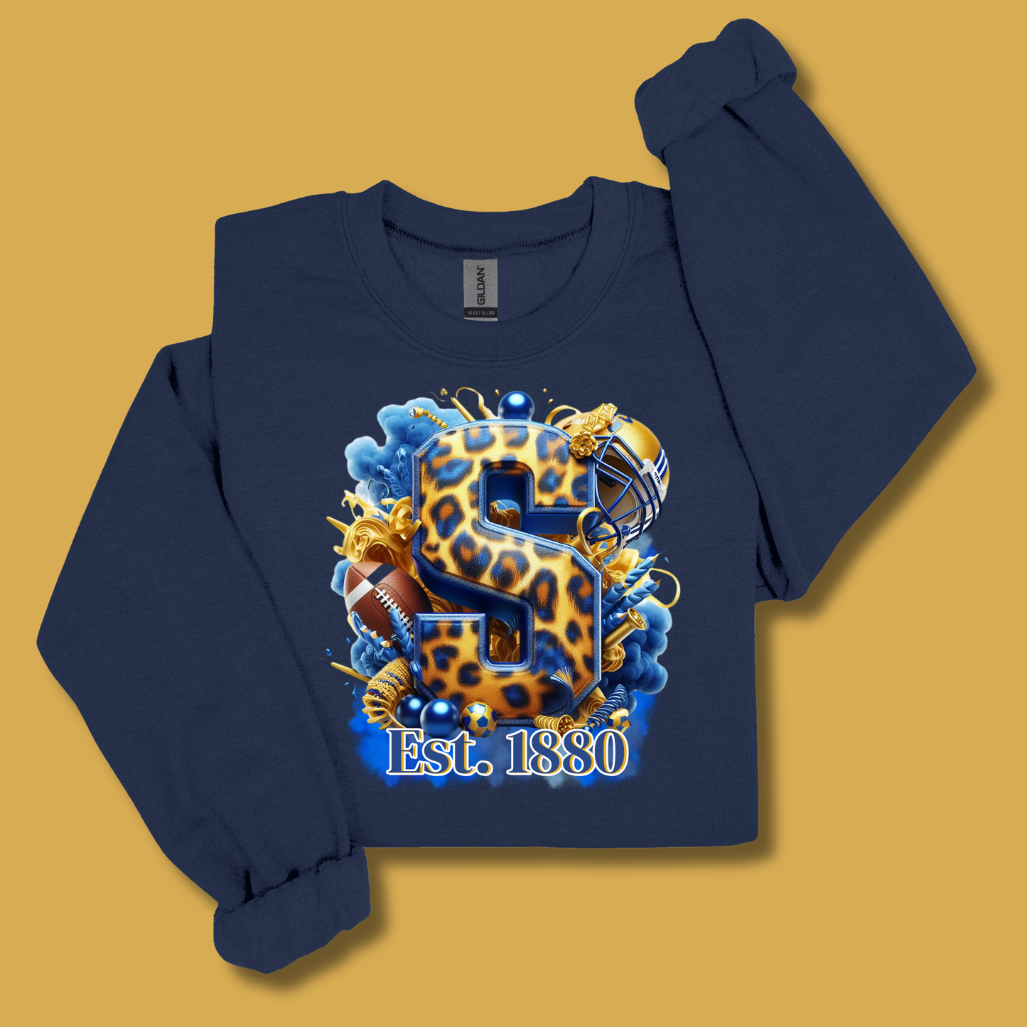A navy blue crewneck sweatshirt with a custom graphic print featuring a leopard-print letter 'S', football, blue water, and the text 'Est. 1880', displayed on a solid mustard yellow background.