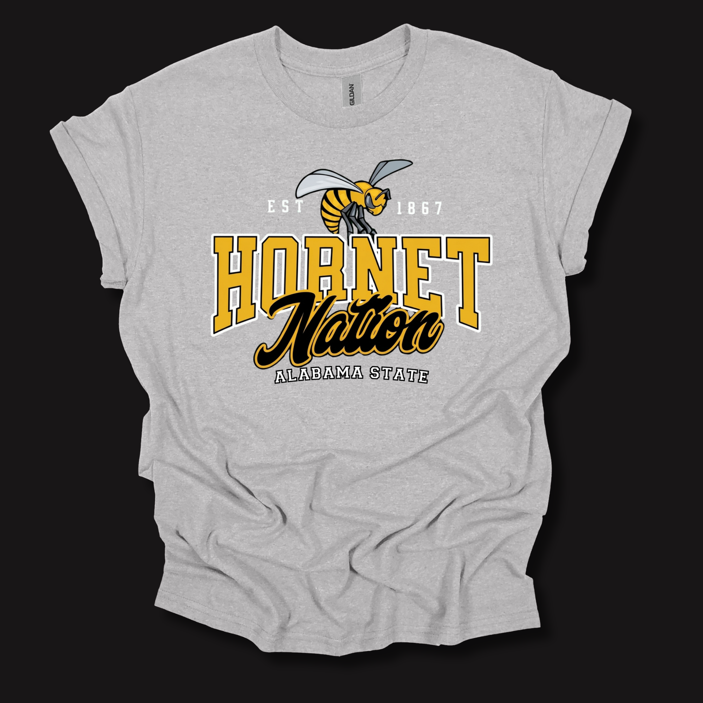 A light heather gray graphic t-shirt featuring the 'Hornet Nation Alabama State' design with a hornet mascot and bold yellow and black lettering, displayed on a solid black background.