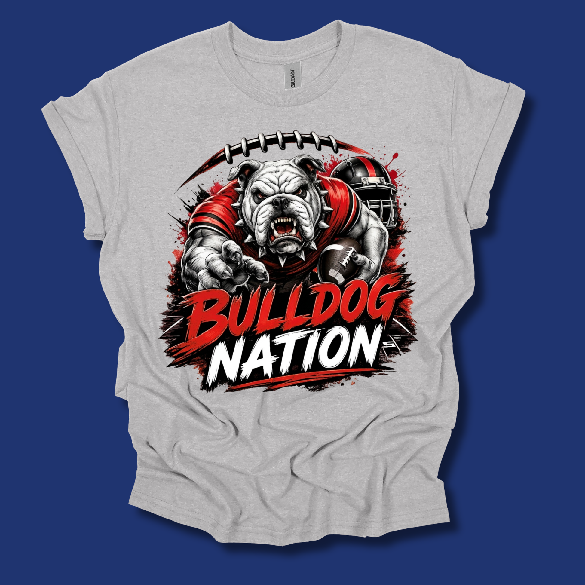 A light heather gray t-shirt with a black graphic reading 'BULL DOG' in decorative block letters, laid flat against a solid dark blue background.