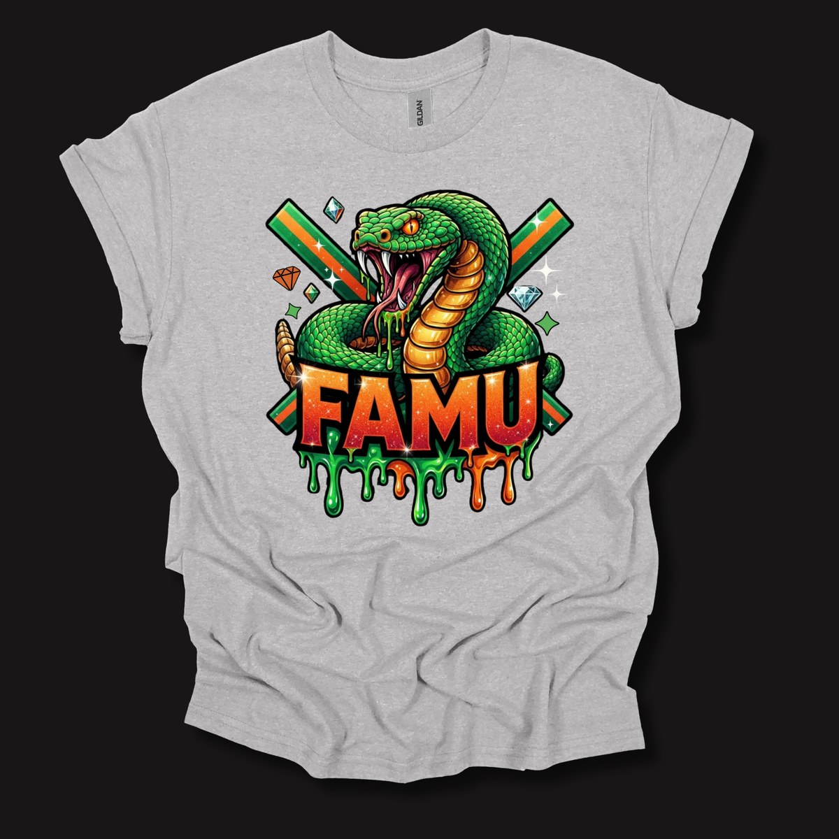 A light gray heather t-shirt with a colorful graphic print of a green snake wrapped around crossed green and orange bats, with the text 'FAMU' in dripping red and orange letters below, displayed on a solid black background.