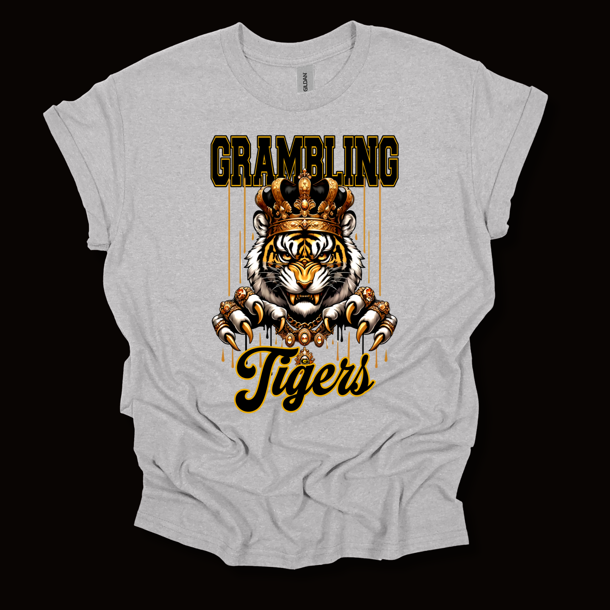 A light heather gray t-shirt with a graphic print of a tiger wearing a crown, with the text 'GRAMBLING' above and 'Tigers' below, displayed against a solid black background.