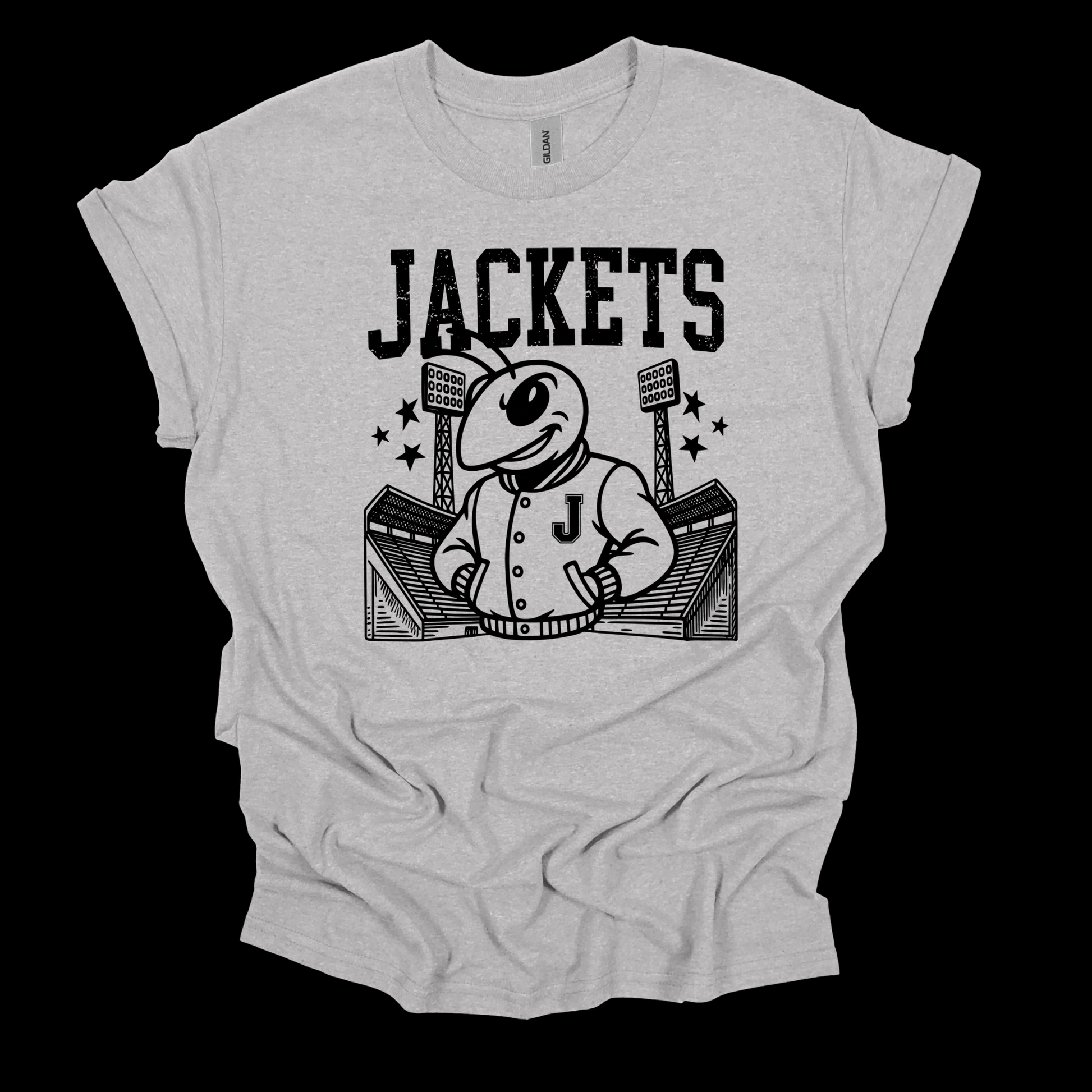 A light heather gray short-sleeve t-shirt with a black graphic print of a cartoon bee mascot wearing a varsity jacket in front of a stadium, with the word 'JACKETS' printed above. The t-shirt is displayed flat against a solid black background.
