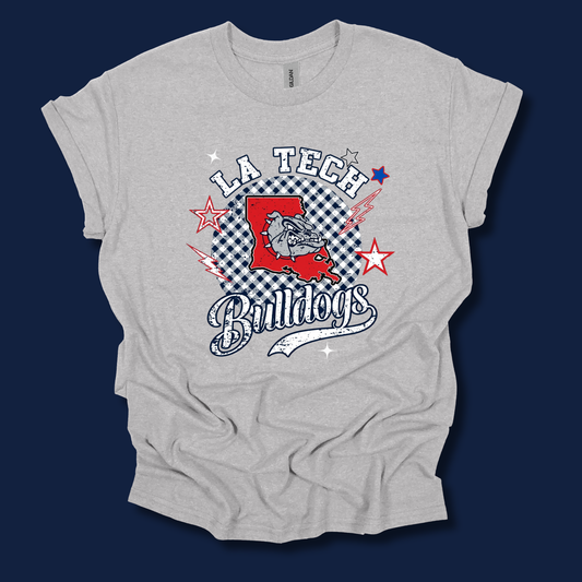 A light heather gray t-shirt with a 'LA Tech Bulldogs' graphic print on the front, displayed against a solid dark navy blue background.