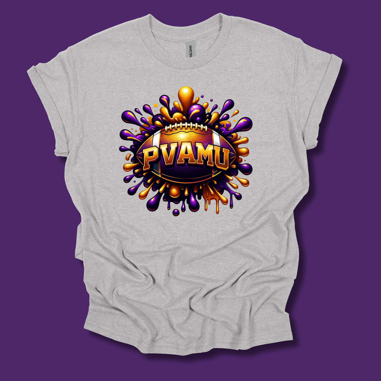 A light heather gray t-shirt with a large, colorful graphic on the front. The graphic features a football surrounded by purple and orange paint splatters, with the text 'PVAMU' in gold letters.