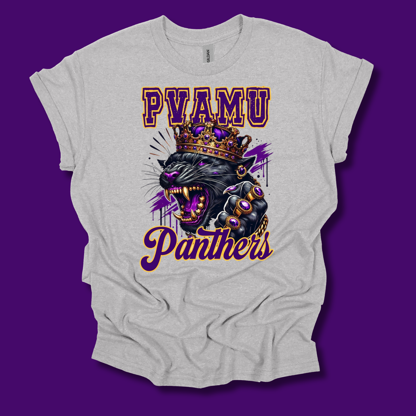 A light heather gray t-shirt with a graphic print of a crowned black panther and the text 'PVAMU Panthers' in purple and gold, displayed against a solid purple background.